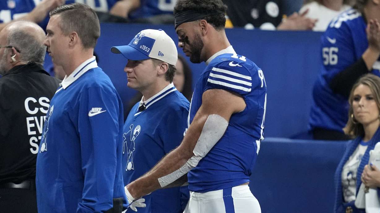 Indianapolis Colts wide receiver Michael Pittman Jr. walks off the field after being injured during the first half of the team's NFL football game against the Pittsburgh Steelers in Indianapolis on Saturday, Dec. 16, 2023.