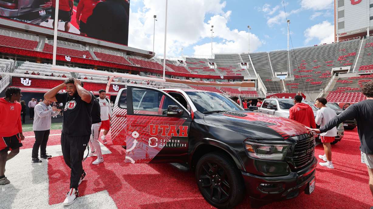 Utah Utes football players look over trucks given to them in Salt Lake City on Oct. 4. The Deseret News is asking a judge to throw out a complaint five Utah universities filed challenging a State Records Committee decision that declared college athletes' name, image and likeness contracts public records.