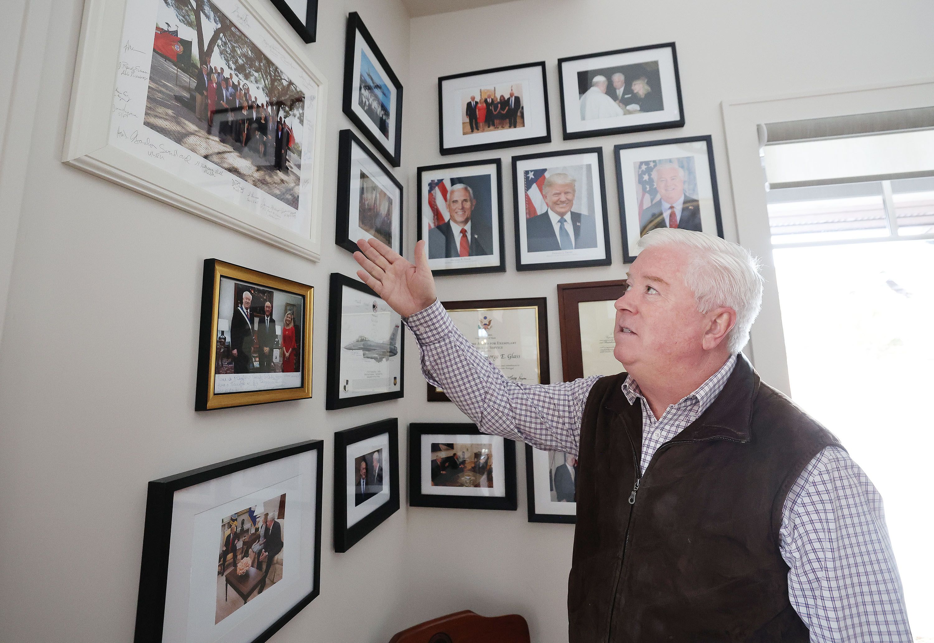 George Glass, former U.S. ambassador to Portugal, talks about photos at his home in Heber City on Wednesday.