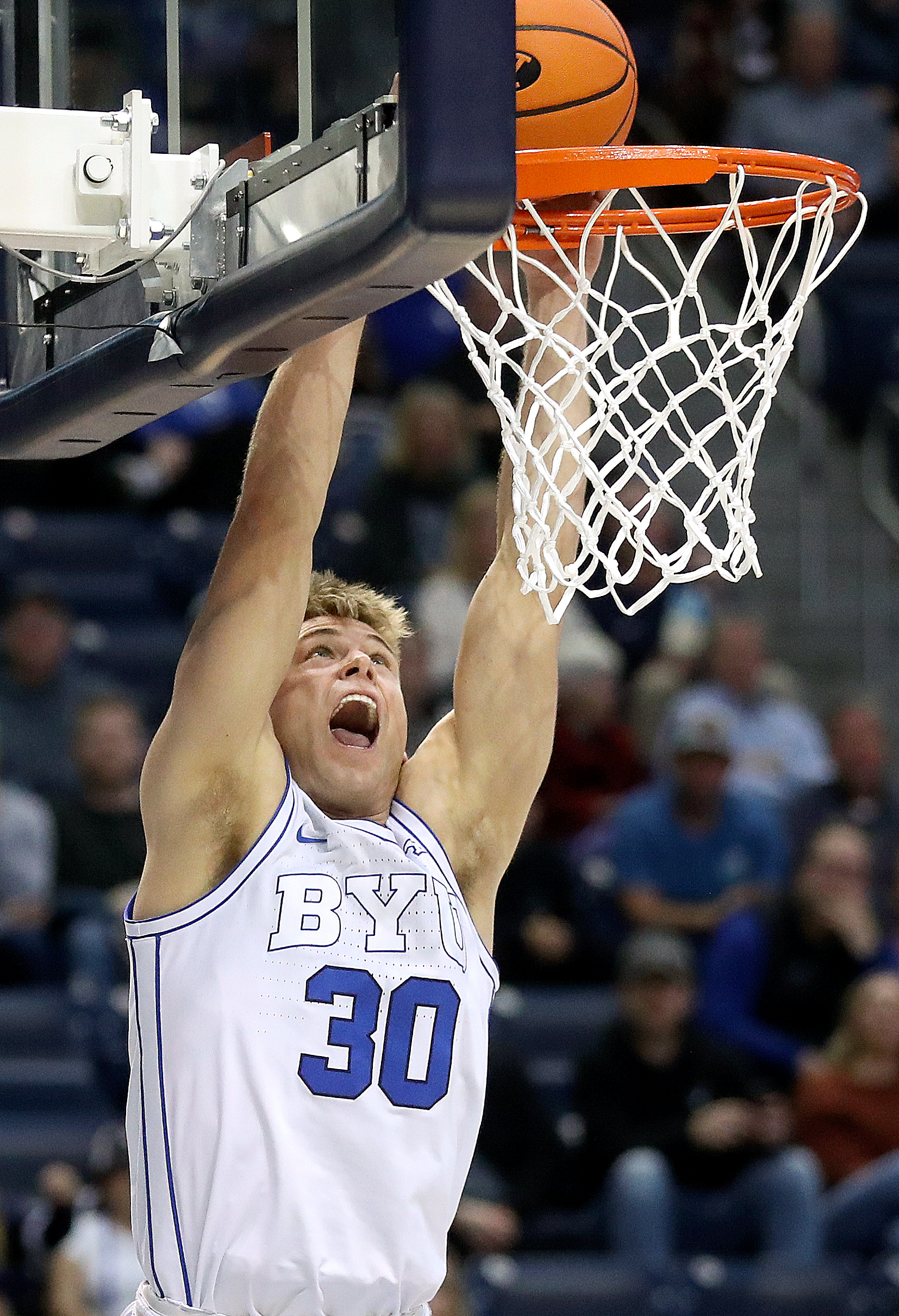 Brigham Young Cougars guard Dallin Hall (30) dunks the ball during a men’s basketball game against the Bellarmine Knights at the Marriott Center in Provo on Friday, Dec. 22, 2023. BYU won 101-59.