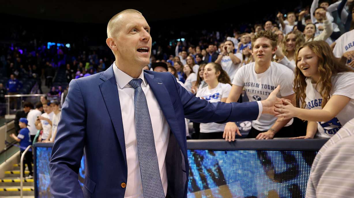 BYU men’s head basketball coach Mark Pope high-fives the front row of the student section after BYU beat Bellarmine in a men’s basketball game at the Marriott Center in Provo on Friday, Dec. 22, 2023. BYU won 101-59.