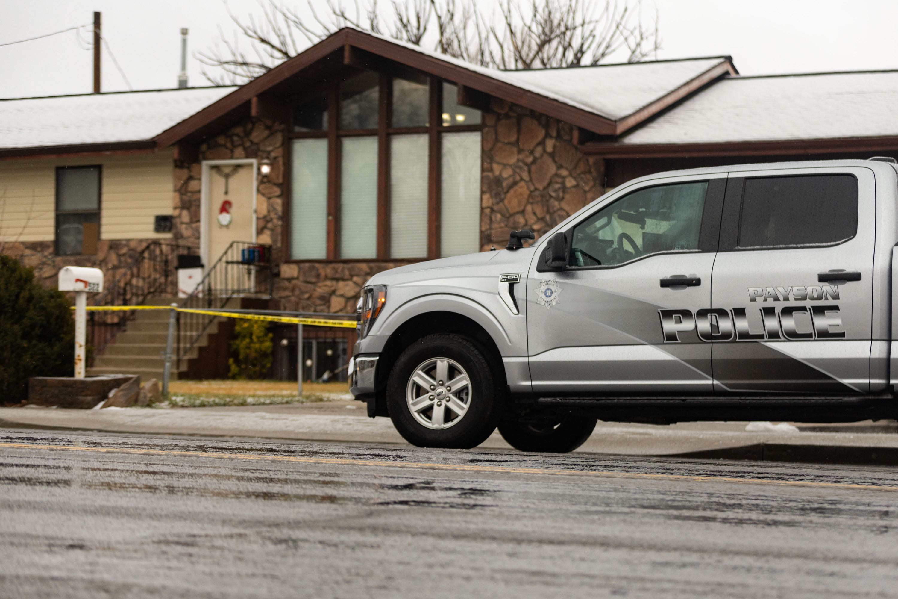 A police car parked in front of a house in Payson on Saturday. One person was found dead and another in serious condition Friday night after Payson police responded to a domestic violence call at a house in the area of 500 N. 600 East.