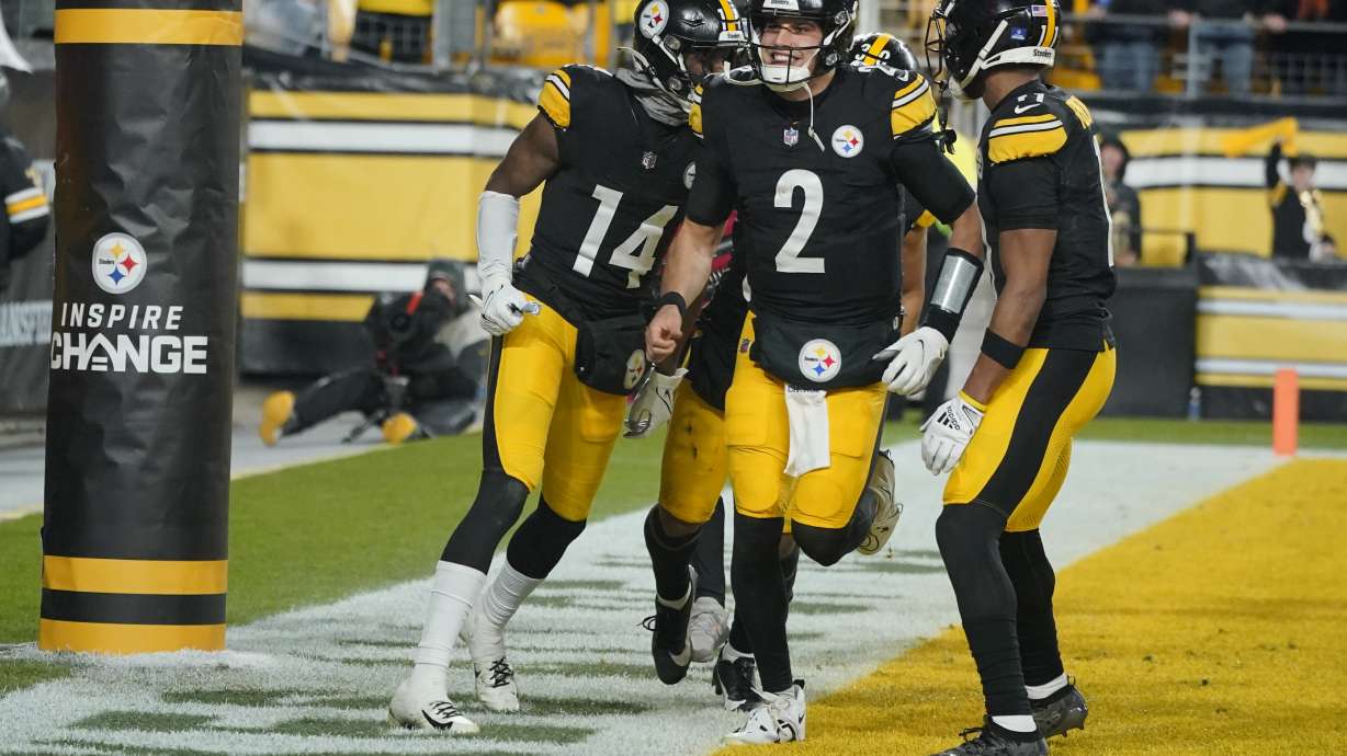 Pittsburgh Steelers quarterback Mason Rudolph (2) and Pittsburgh Steelers wide receiver George Pickens (14) and Pittsburgh Steelers wide receiver Allen Robinson II (11) celebrate Pickens scoring a touchdown during the second half of an NFL football game against the Cincinnati Bengals, Saturday, Dec. 23, 2023, in Pittsburgh.