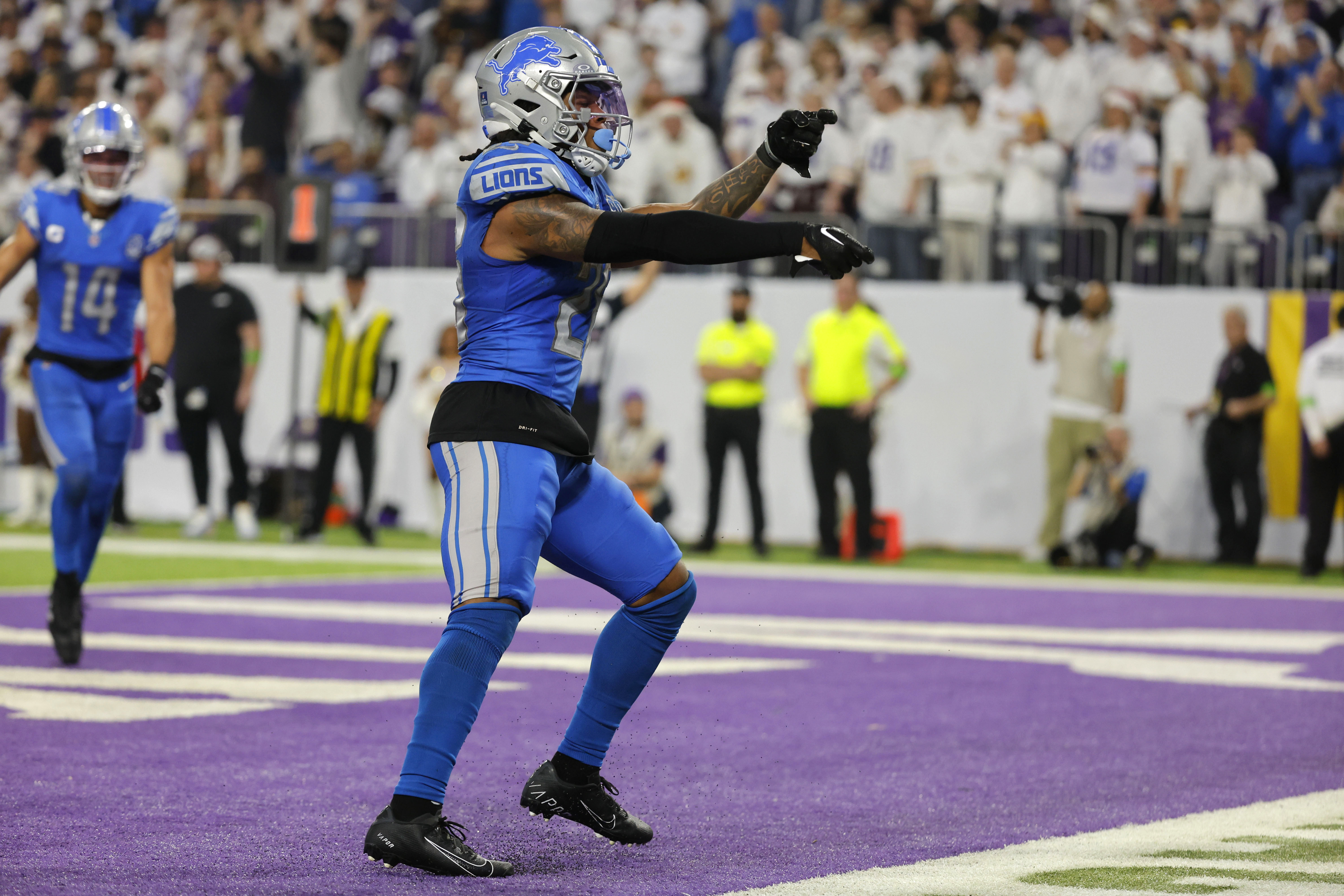 Detroit Lions running back Jahmyr Gibbs (26) celebrates after scoring on a 3-yard touchdown run during the second half of an NFL football game against the Minnesota Vikings, Sunday, Dec. 24, 2023, in Minneapolis.