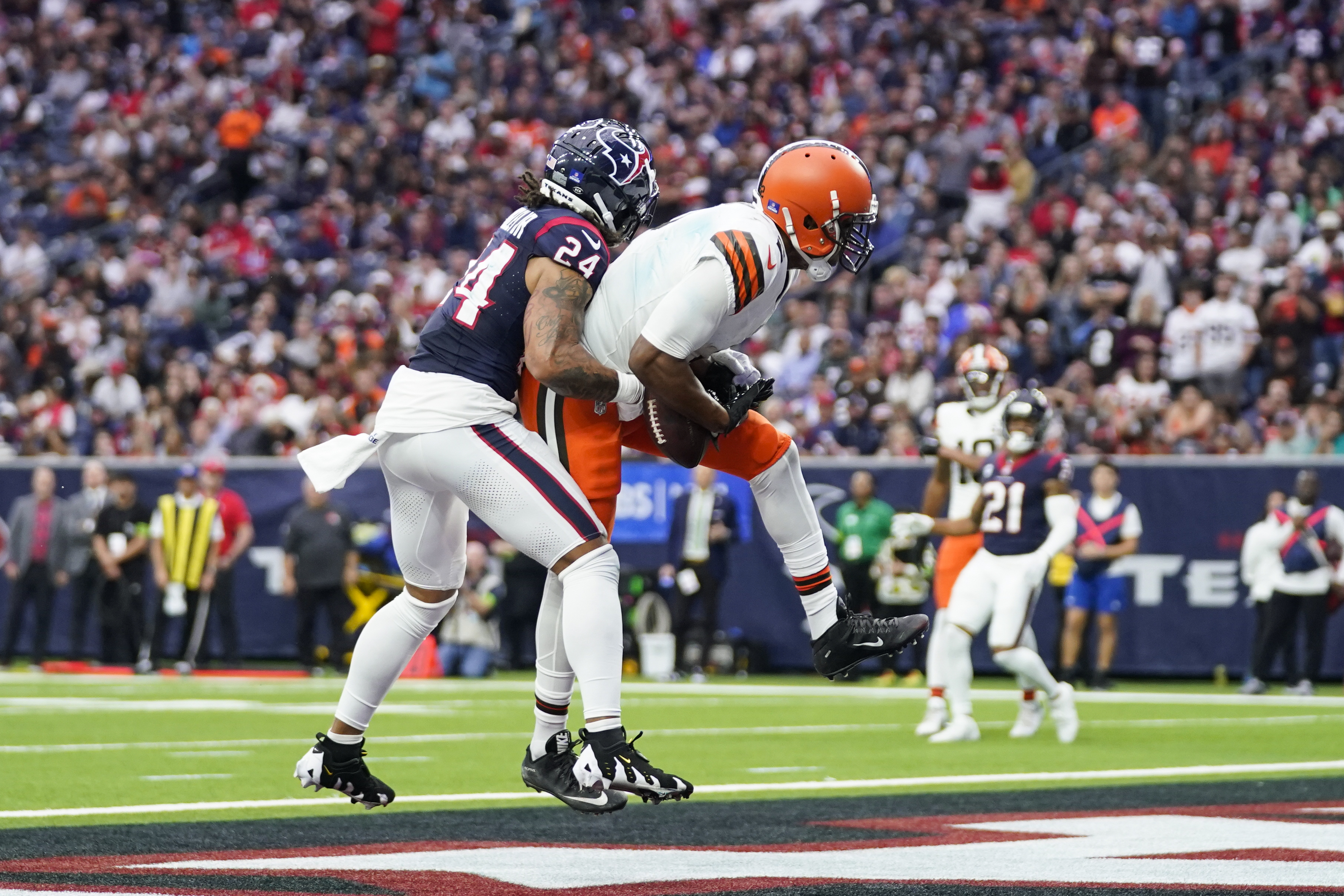 Cleveland Browns wide receiver Amari Cooper (2) catches a pass for a touchdown as Houston Texans cornerback Derek Stingley Jr. (24) defends during the second half of an NFL football game Sunday, Dec. 24, 2023, in Houston.