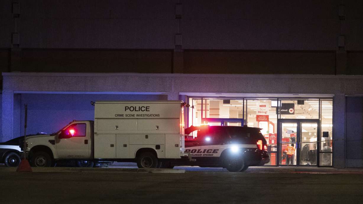 Colorado Springs Police Department investigators continue working the scene at Citadel Mall in Colorado Springs, Colo., late Christmas Eve after authorities said a fatal shooting occurred at the shopping center on Sunday.