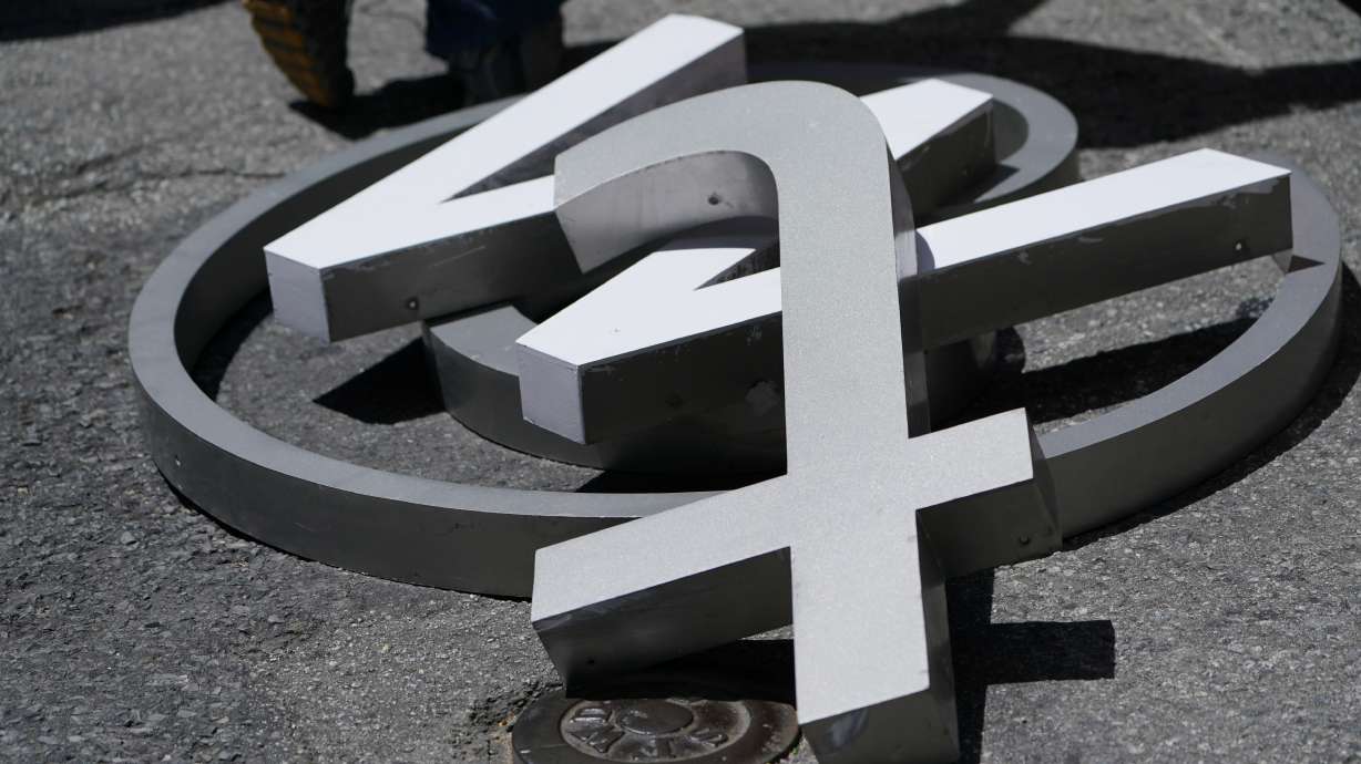 Characters removed from a sign on the Twitter headquarters building are piled on a street in San Francisco on July 24.