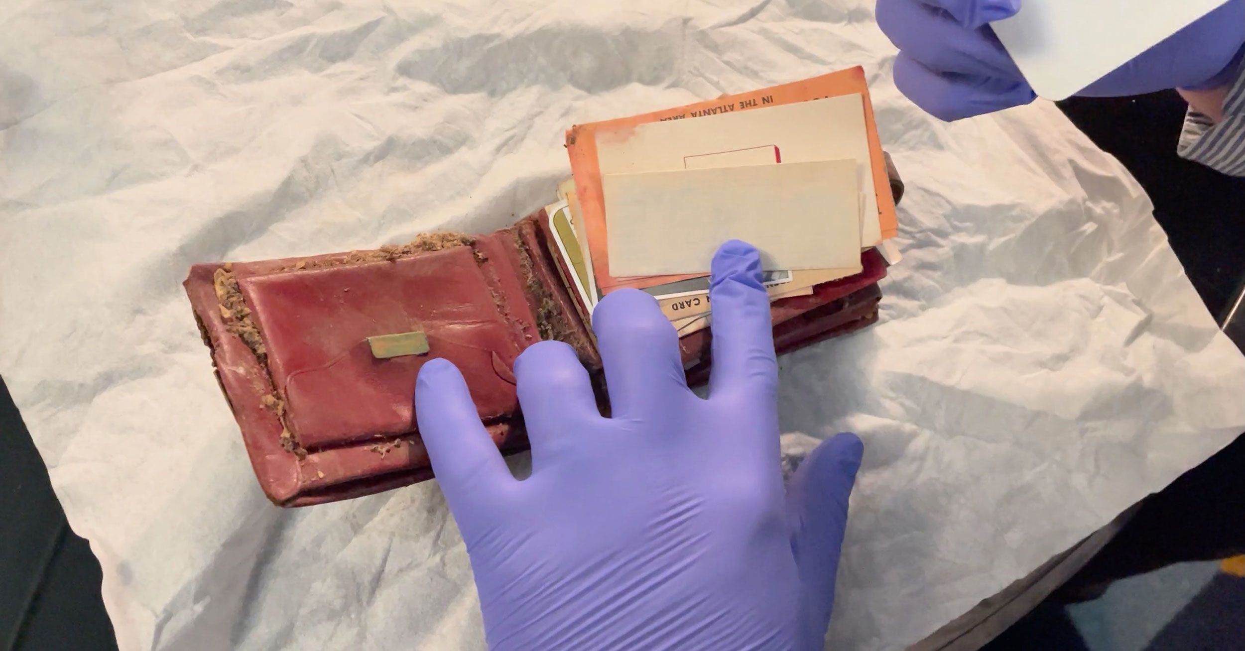 A wallet was found behind a bathroom wall at the Plaza Theatre in Atlanta, Ga.