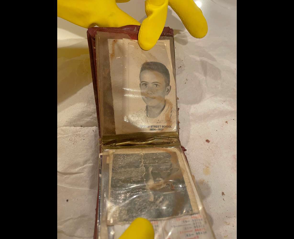 A wallet was found behind a bathroom wall at the Plaza Theatre in Atlanta, Ga.