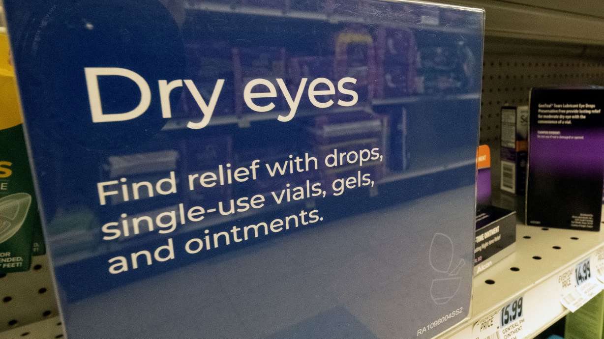 A selection of eye drops line a shelf at a pharmacy in Los Angeles on Dec. 12