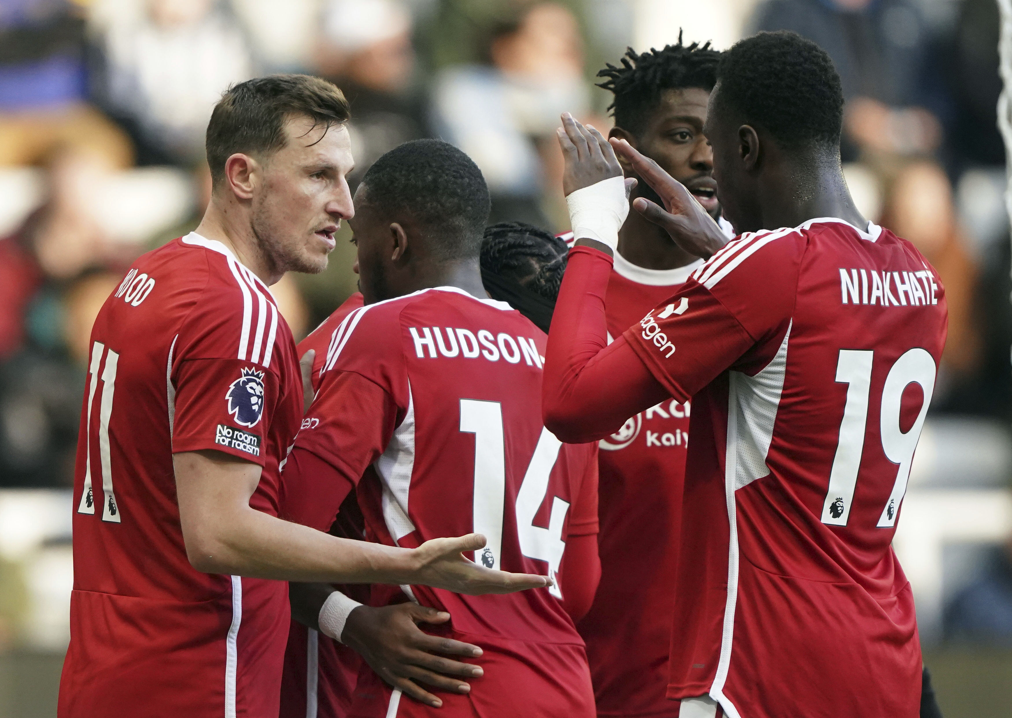 Nottingham Forest's Chris Wood, left, celebrates scoring his side's first goal during the English Premier League soccer match between Newcastle United and Nottingham Forest at St. James' Park, Newcastle upon Tyne, England, Tuesday, Dec. 26, 2023.