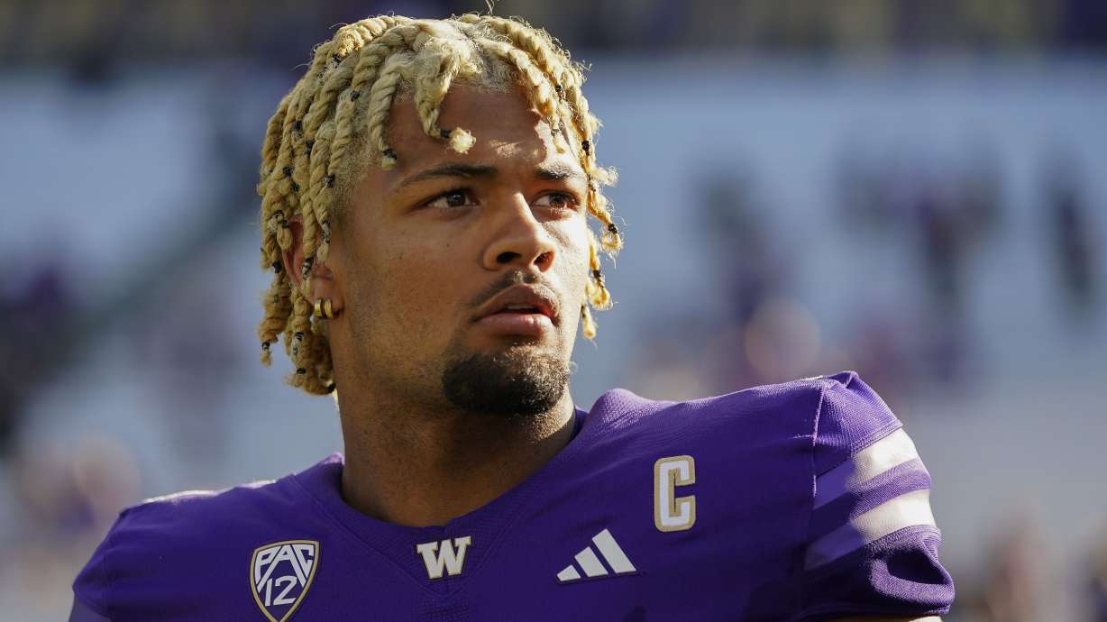 FILE - Washington wide receiver Rome Odunze looks into the stands after an NCAA college football game against Tulsa, Sept. 9, 2023, in Seattle. Odunze, who played the middle portion of the year with a broken rib and finished the year as a first-team All-American on seemingly every list, will face No. 3 Texas in the Sugar Bowl Monday, Jan. 1, 2024.