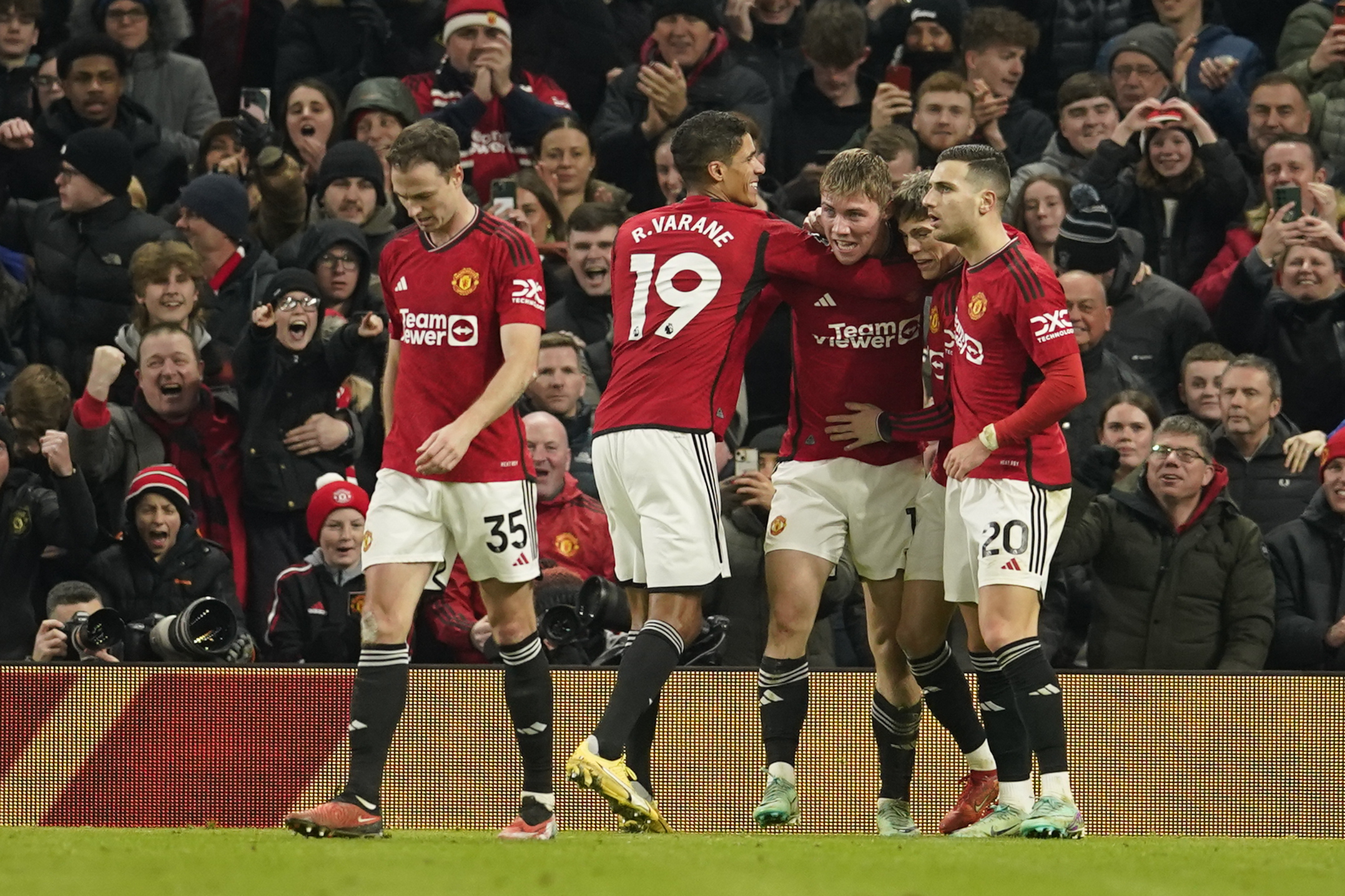 Manchester United's Rasmus Hojlund, centre right, celebrates after scoring his side's third goal during the English Premier League soccer match between Manchester United and Aston Villa at the Old Trafford stadium in Manchester, England, Tuesday, Dec. 26, 2023. 