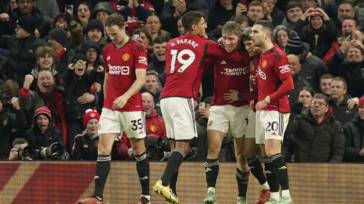 Manchester United's Rasmus Hojlund, centre right, celebrates after scoring his side's third goal during the English Premier League soccer match between Manchester United and Aston Villa at the Old Trafford stadium in Manchester, England, Tuesday, Dec. 26, 2023.