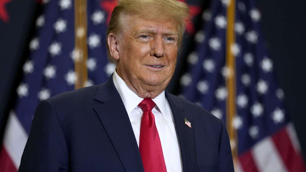 Former President Donald Trump speaks during a commit to caucus rally, Dec. 19. Police said Tuesday they are investigating incidents directed at Colorado Supreme Court justices and providing extra patrols around their homes.