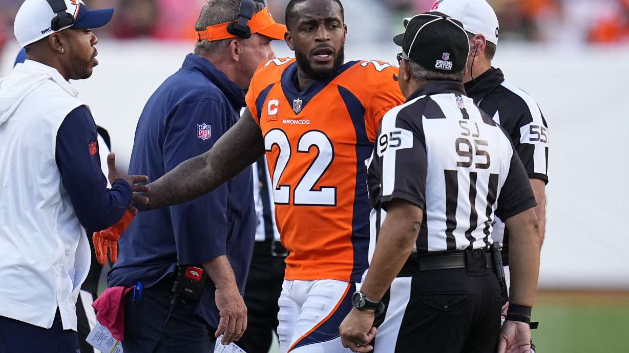 FILE -Denver Broncos safety Kareem Jackson (22) reacts to be disqualified from the game against the Green Bay Packers during an NFL football game Sunday, Oct. 22, 2023, in Denver. Broncos safety Kareem Jackson returned to practice Wednesday, Dec. 20, 2023 after completing his second suspension. Jackson missed Denver's last four games. Jackson has forfeited nearly $1 million in fines and paychecks over a series of over-the-top tackles this season.