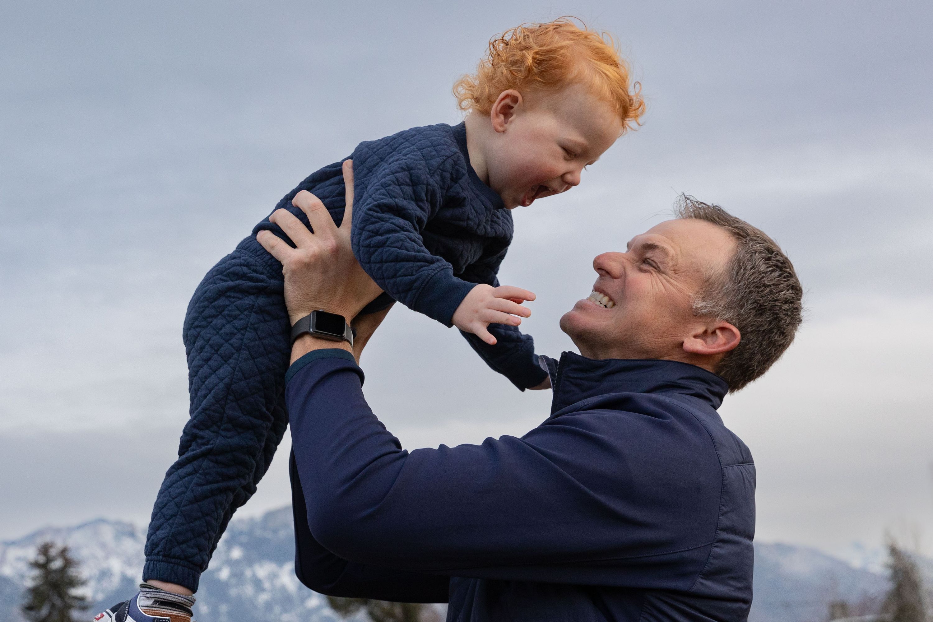 Rep. Blake Moore, R-Utah, holds up his son Franklin, 2, while playing with his children during a photo shoot at Dilworth Elementary School in Salt Lake City on Friday.