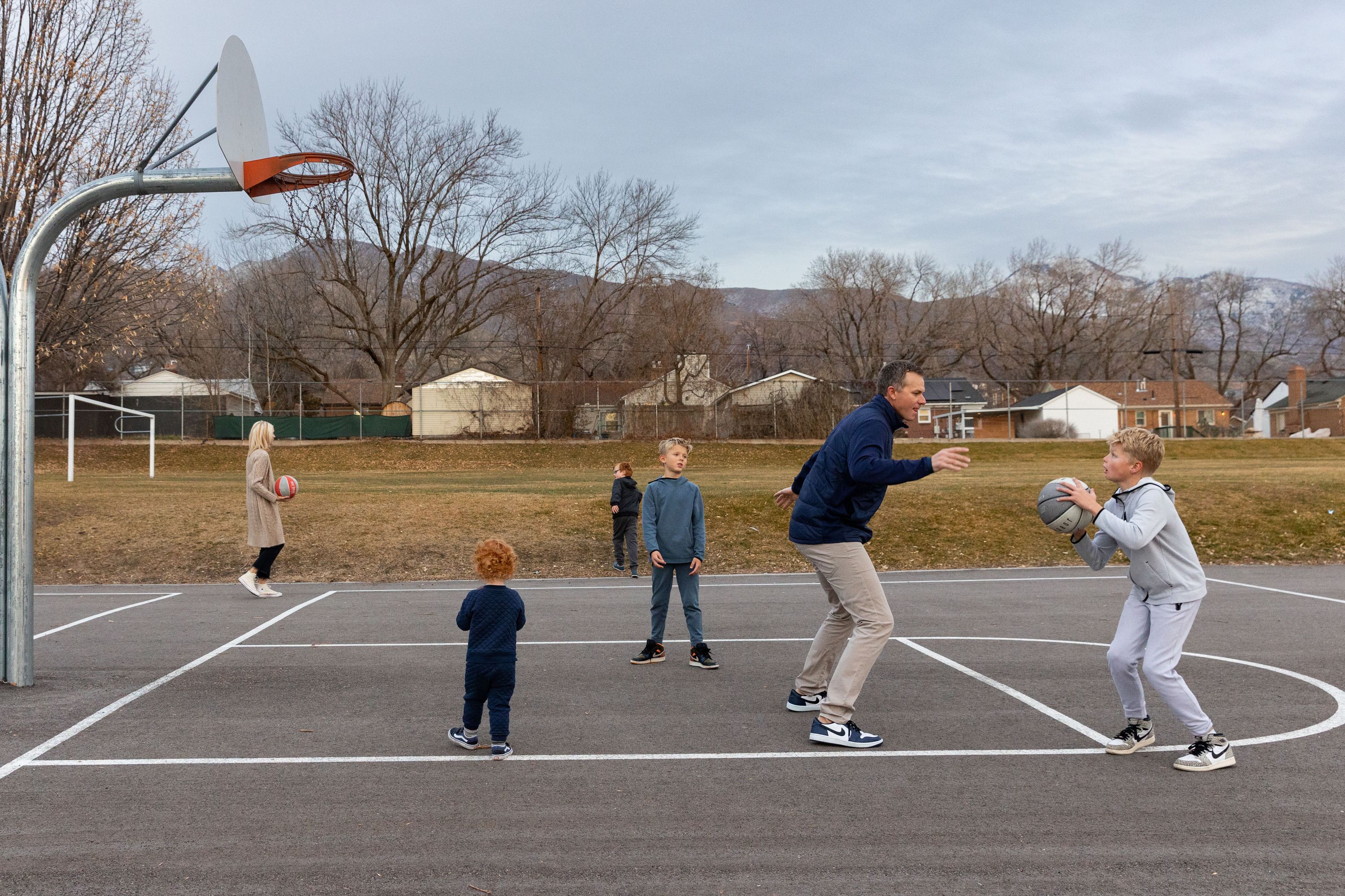 Rep. Blake Moore, R-Utah, plays with his children during a photo shoot at Dilworth Elementary School in Salt Lake City on Friday.