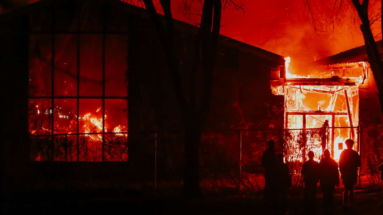 Fire crews battle a blaze at a 27,000-square-foot home in Orem Tuesday evening.