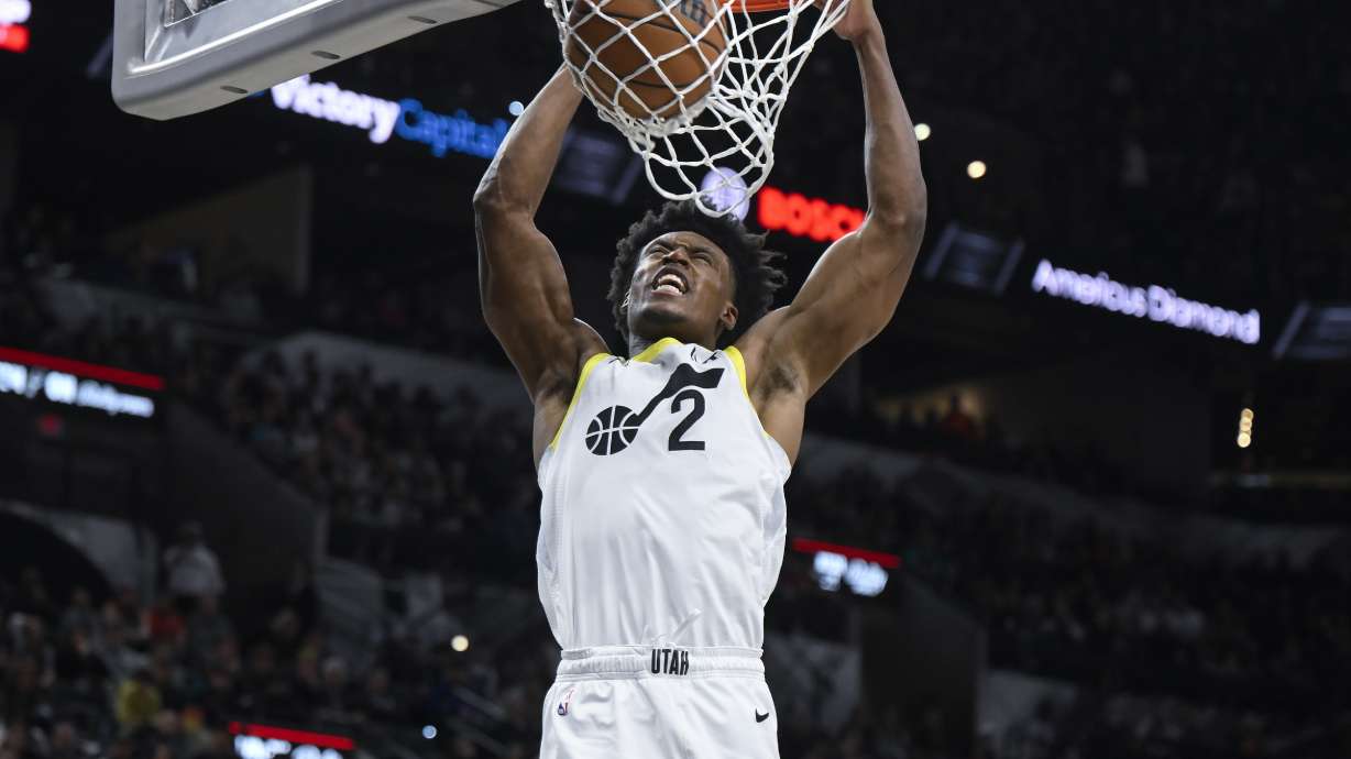 Utah Jazz's Collin Sexton dunks during the second half of the team's NBA basketball game against the San Antonio Spurs, Tuesday, Dec. 26, 2023, in San Antonio.