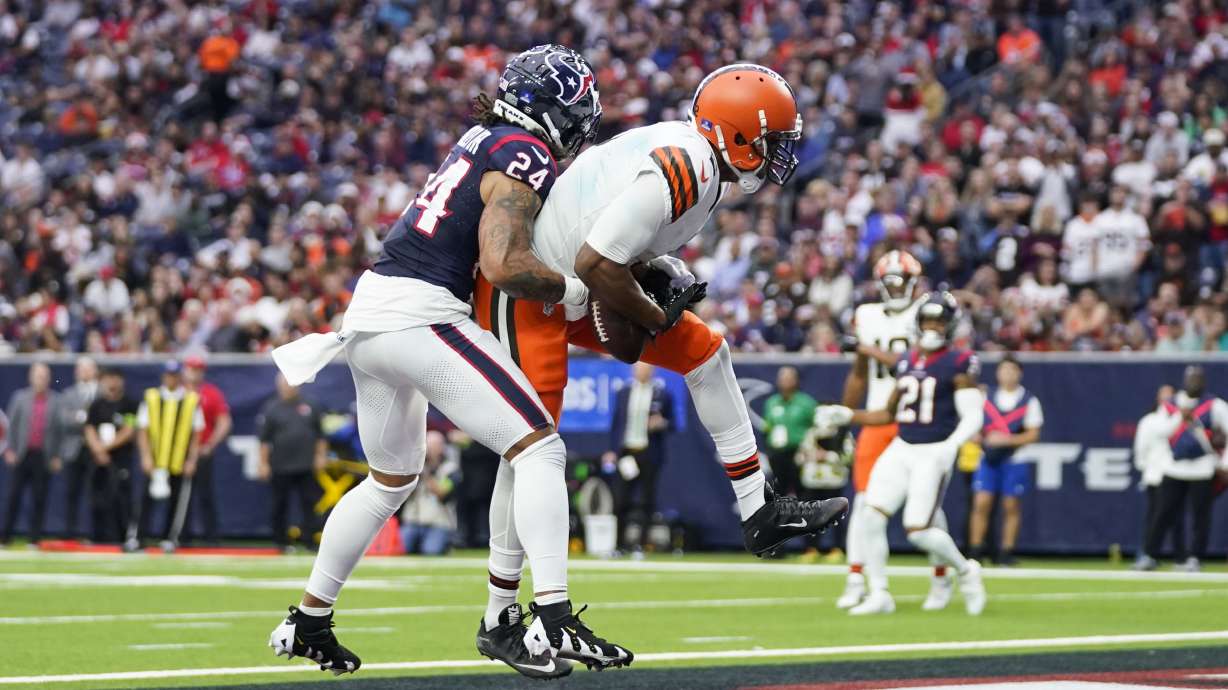 Cleveland Browns wide receiver Amari Cooper (2) catches a pass for a touchdown as Houston Texans cornerback Derek Stingley Jr. (24) defends during the second half of an NFL football game Sunday, Dec. 24, 2023, in Houston.