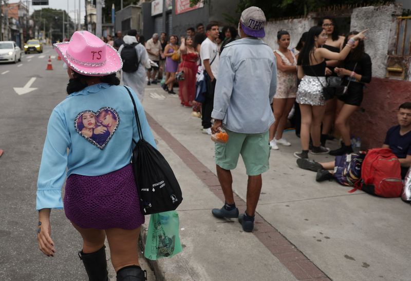 Fans wait in line outside Nilton Santos stadium for the Taylor Swift concert, following the death of a fan due to the heat during the first day concert, in Rio de Janeiro, Brazil, Nov. 20.