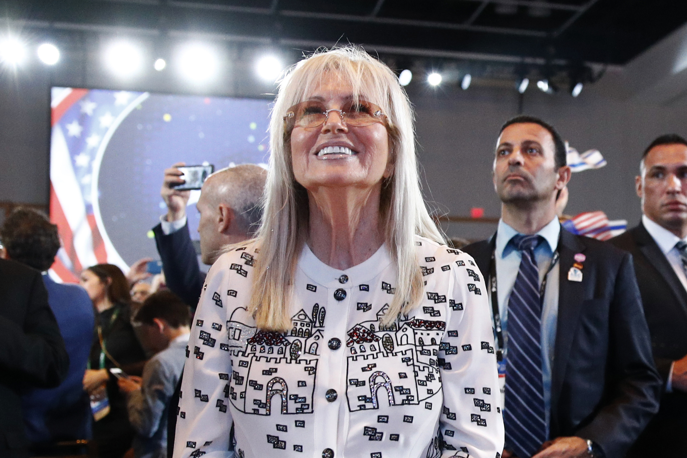 FILE - Miriam Adelson, wife of Las Vegas Sands Corporation Chief Executive and Republican mega donor Sheldon Adelson, listens as President Donald Trump speaks at the Israeli American Council National Summit in Hollywood, Fla., Saturday, Dec. 7, 2019. On Wednesday, Dec. 27, 2023, the NBA approved the sale of controlling interest of the Dallas Mavericks from Mark Cuban to the families that run the Las Vegas Sands casino company. 