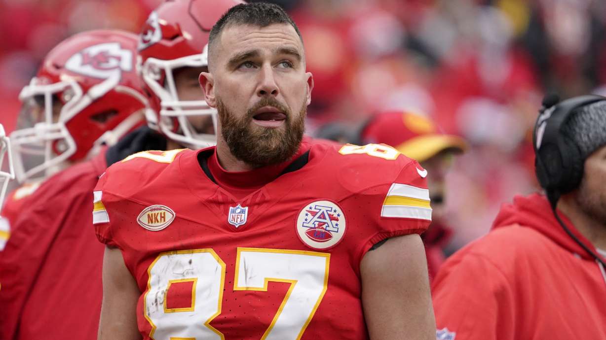 Kansas City Chiefs tight end Travis Kelce watches from the sidelines during the first half of an NFL football game against the Las Vegas Raiders Monday, Dec. 25, 2023, in Kansas City, Mo.