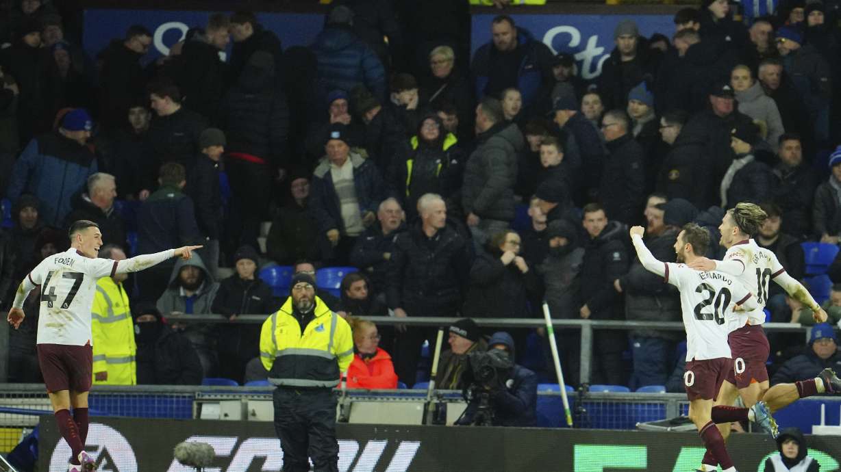 Manchester City's Bernardo Silva, second right, celebrates after scoring his sides third goal during the English Premier League soccer match between Everton and Manchester City at Goodison Park stadium in Liverpool, England, Wednesday, Dec. 27, 2023.