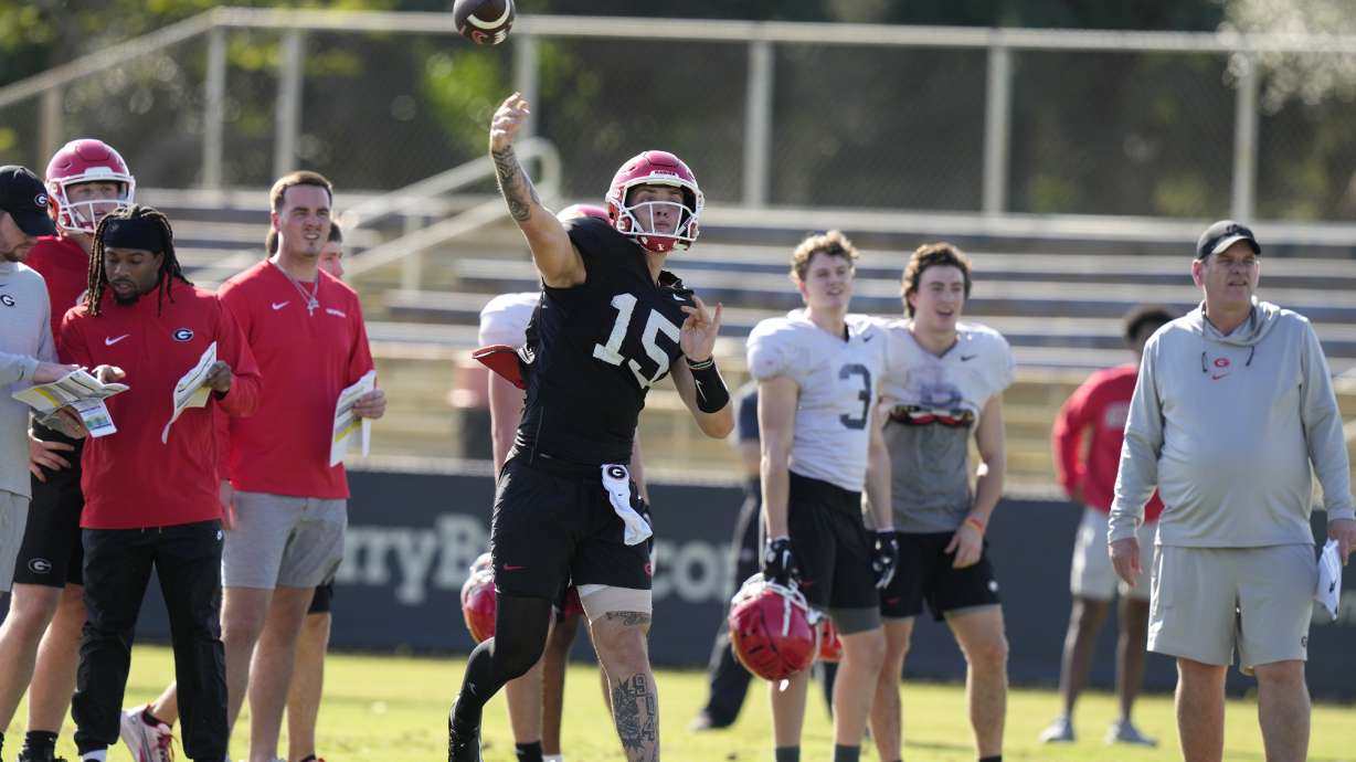 Georgia quarterback Carson Beck (15) does drills as the team prepares for the Orange Bowl NCAA college football game, Wednesday, Dec. 27, 2023, in Miami. Georgia is scheduled to play Florida State in the Orange Bowl Saturday at Hard Rock Stadium in Miami Gardens.