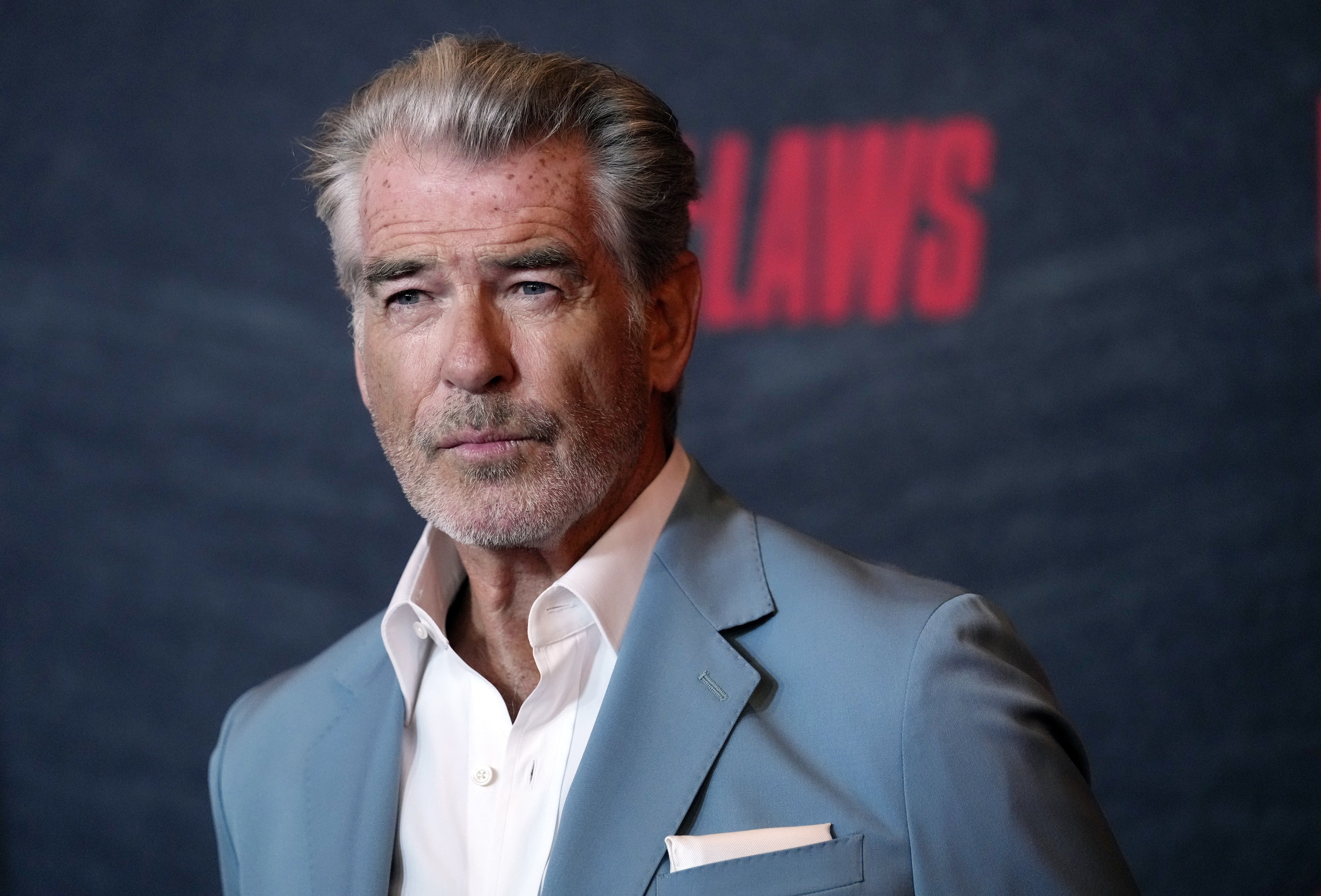 Pierce Brosnan, a cast member in "The Out-Laws," poses at a special screening of the film, June 26, in Los Angeles. Brosnan faces two citations and a court date for allegedly stepping out of bounds in a thermal area during a recent visit to Yellowstone National Park.  