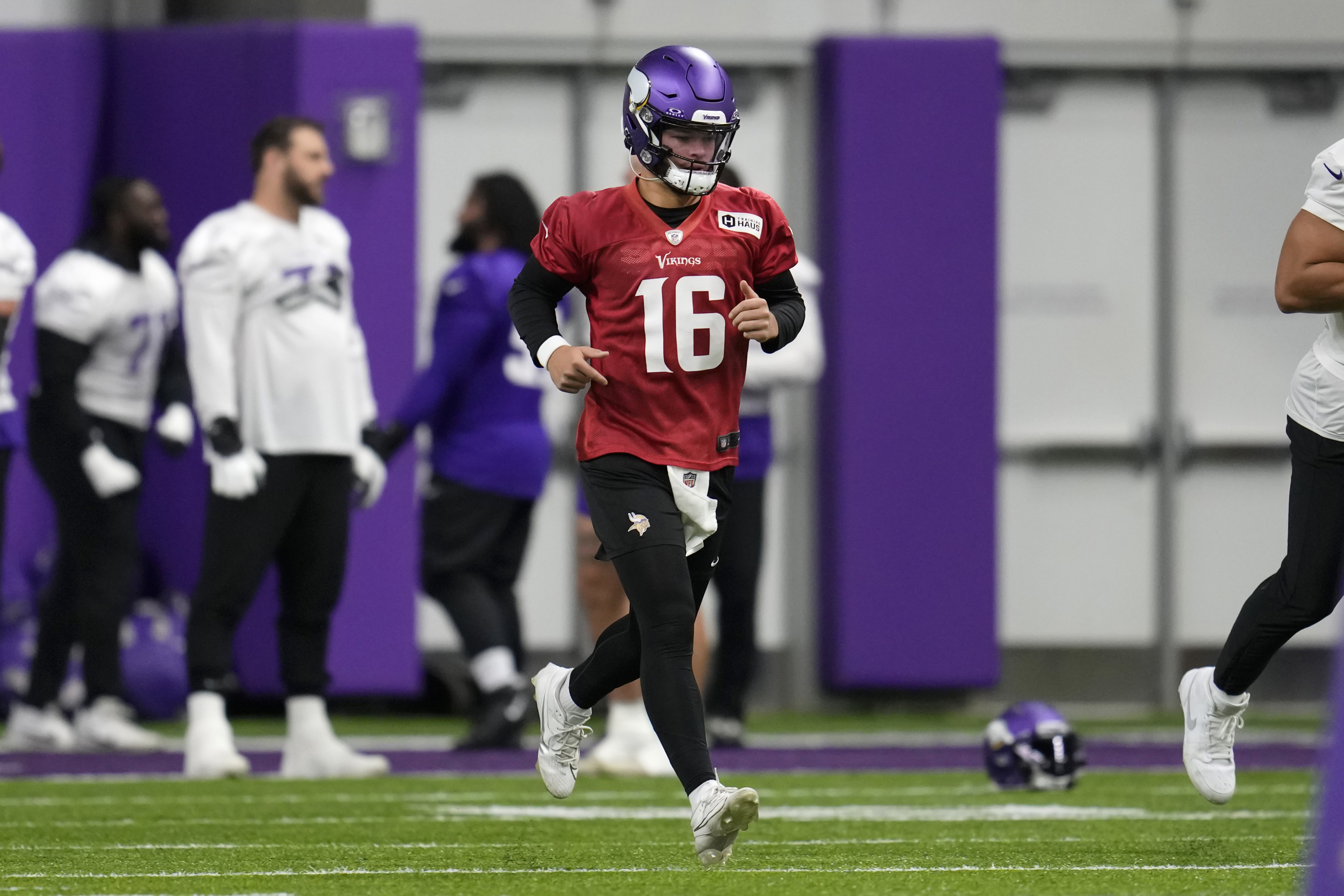 Minnesota Vikings quarterback Jaren Hall (16) takes part in drills during NFL football practice in Eagan, Minn., Monday, Dec. 4, 2023.