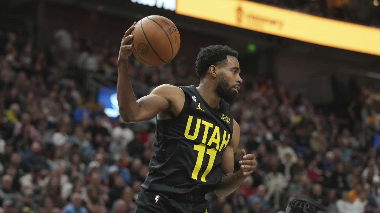 Utah Jazz guard Mike Conley is in action in the second half during an NBA basketball game against the Miami Heat, Saturday, Dec. 31, 2022, in Salt Lake City.