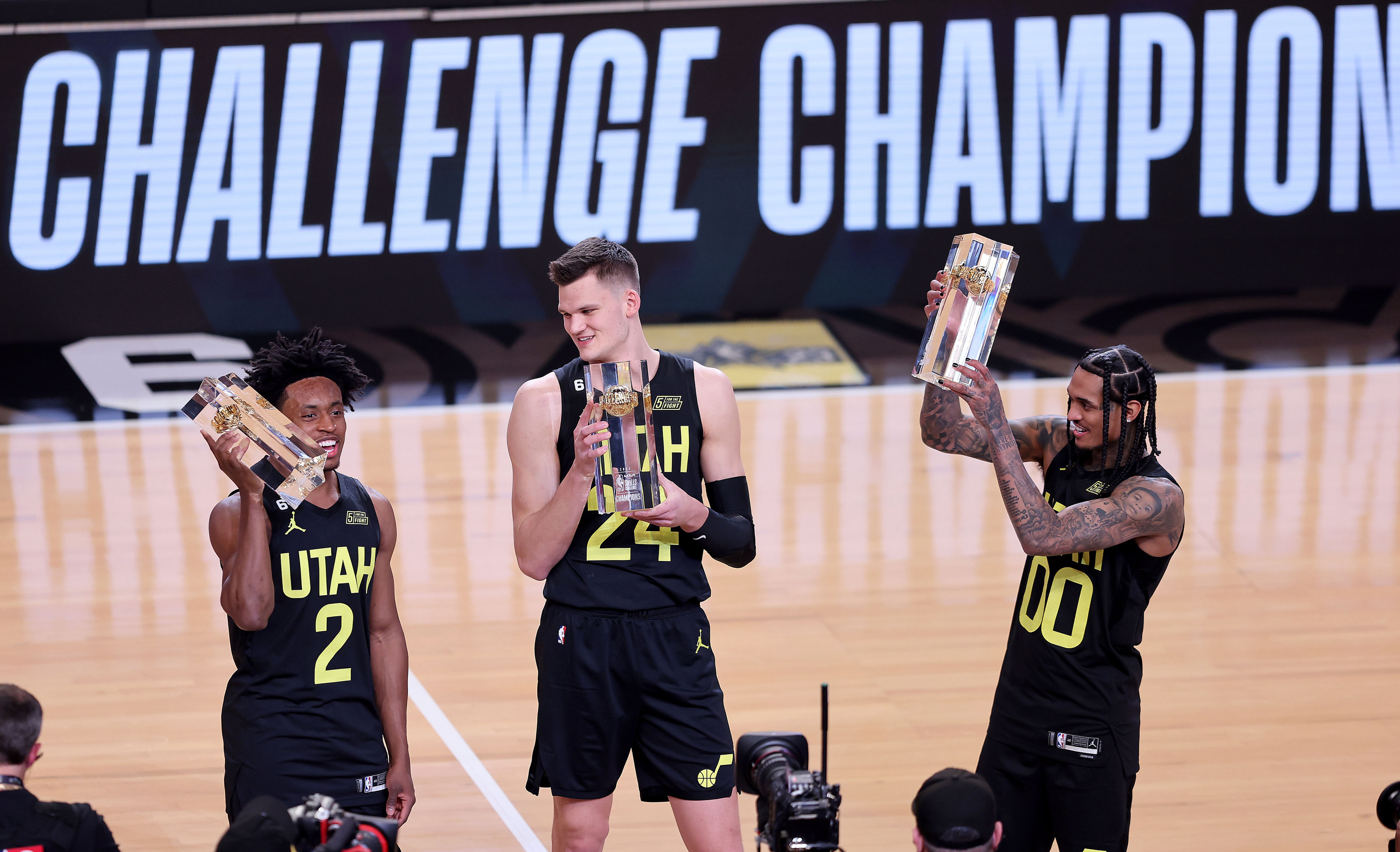 Jazz players Collin Sexton, Walker Kessler and Jordan Clarkson celebrate their passing and shooting victory during the NBA All-Star Skills Challenge at Vivint Arena Saturday Feb. 18, 2023.