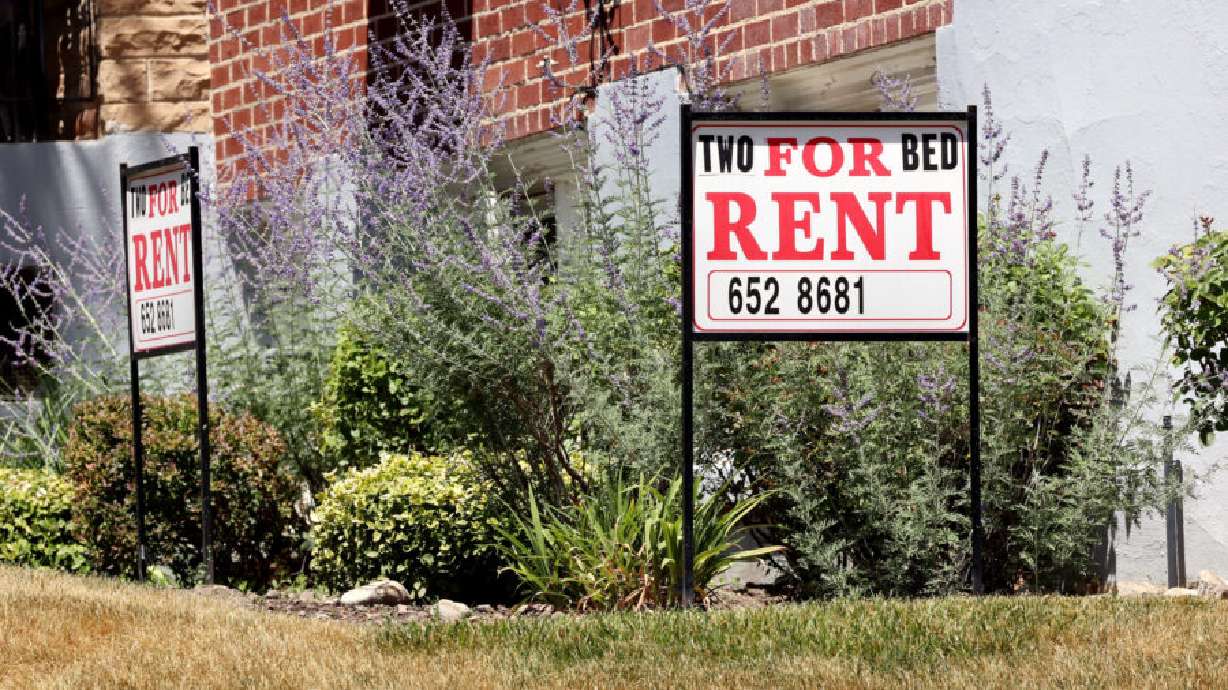 Rent signs are placed at a home in Salt Lake City on July 10. Rent is spiking in Utah, according to analysts.