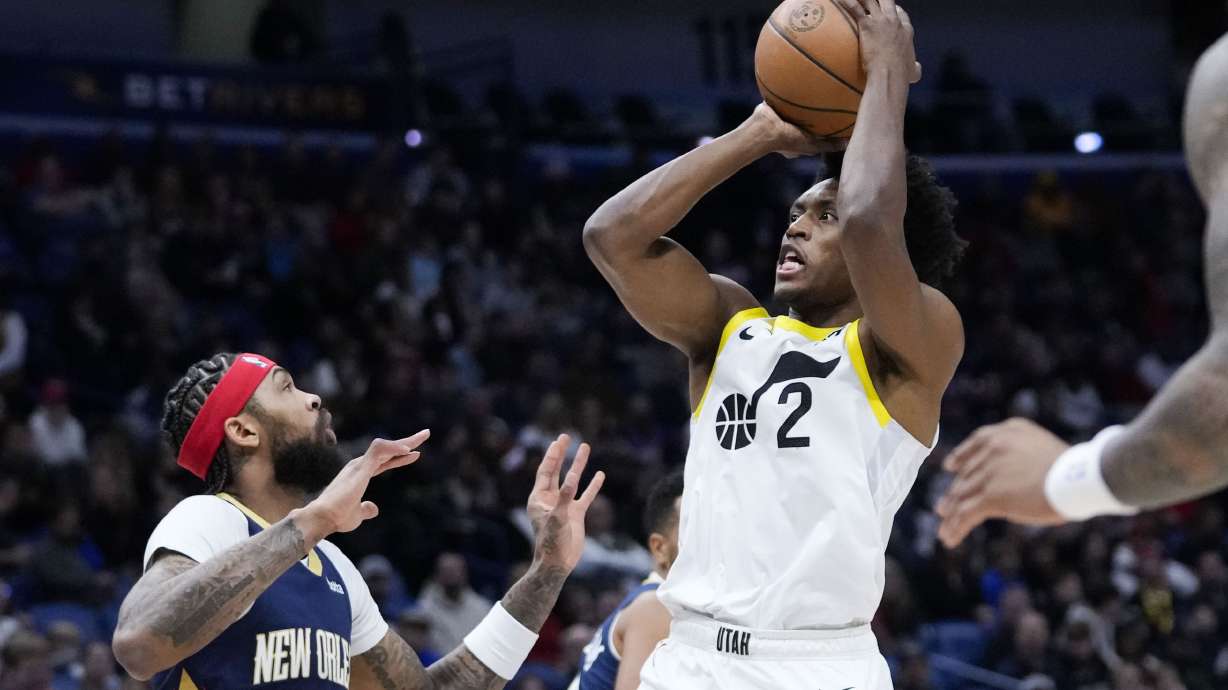 Utah Jazz guard Collin Sexton (2) shoots against New Orleans Pelicans forward Brandon Ingram (14) in the first half of an NBA basketball game in New Orleans, Thursday, Dec. 28, 2023.