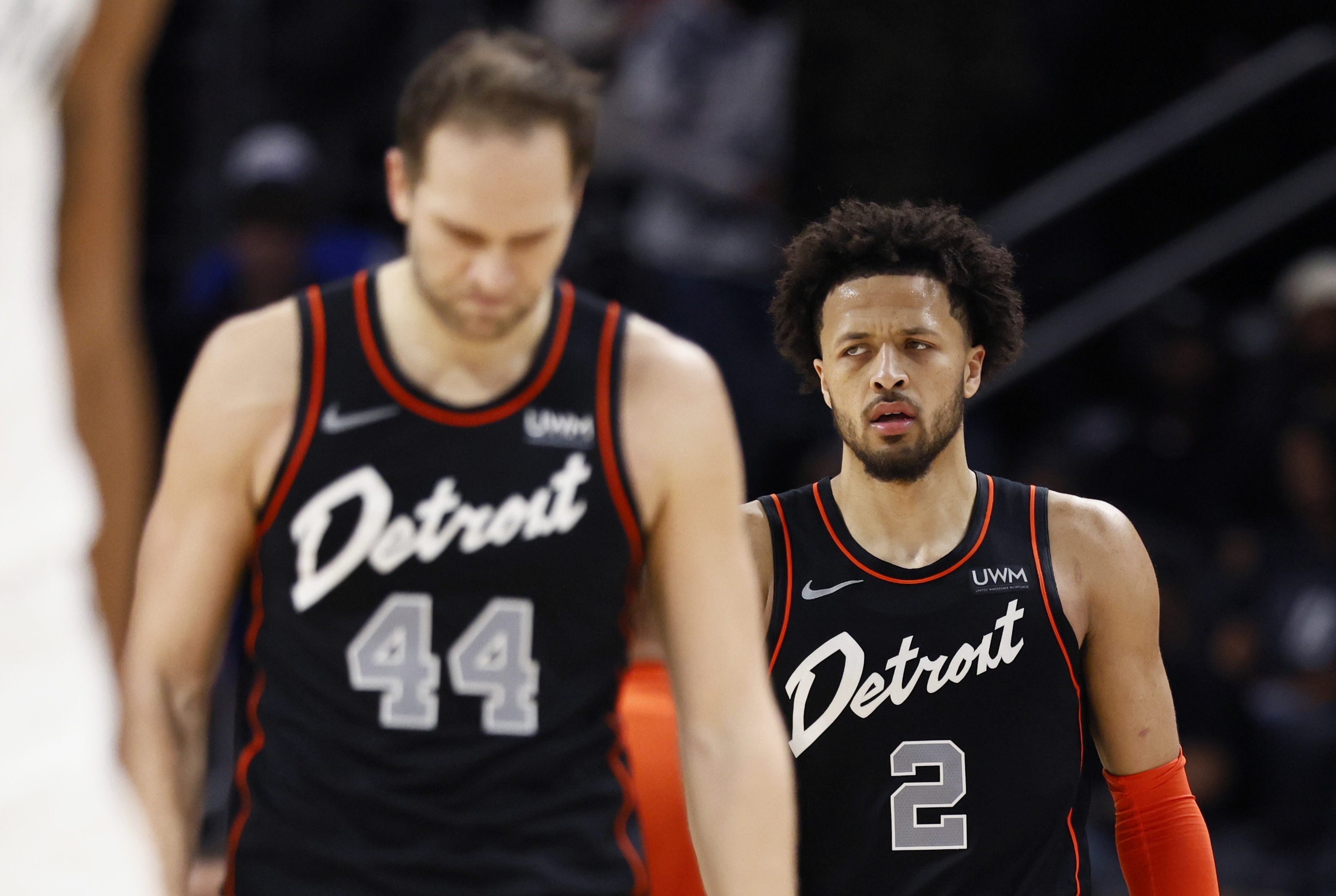 Detroit Pistons forward Bojan Bogdanovic (44) and guard Cade Cunningham (2) return to the court during the fourth quarter of the team's NBA basketball game against the Brooklyn Nets on Tuesday, Dec. 26, 2023, in Detroit. The Pistons set an NBA single-season record with 27 straight losses.