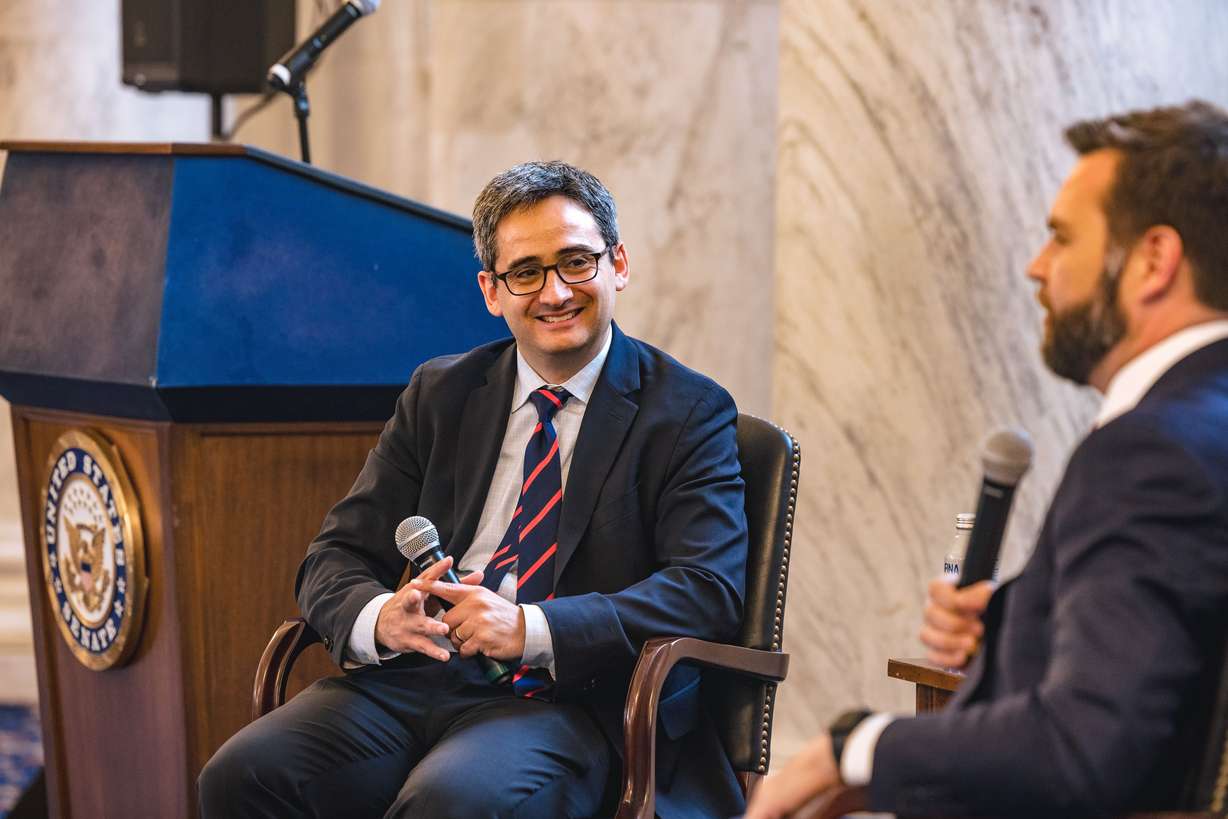Oren Cass speaks with Sen. J.D. Vance, R-Ohio, at the Rebuilding American Capitalism forum in the Russell Senate Office Building in Washington, D.C., on June 21.