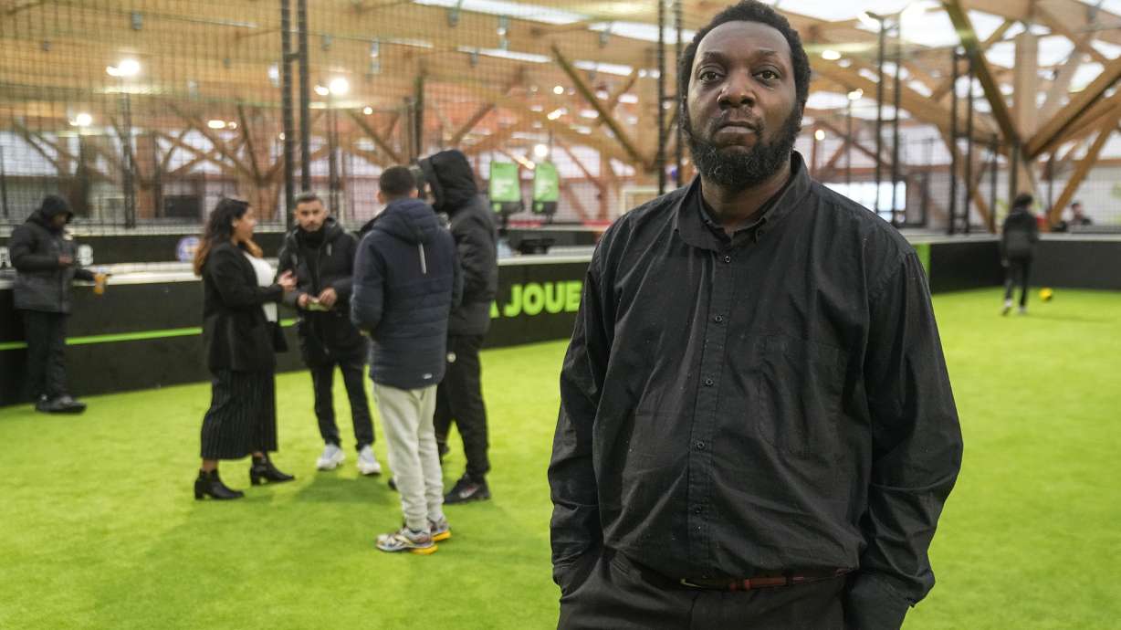 Job seeker Fandio Aldo poses for a photograph during the Olympics jobs fair at sport center in Paris, Thursday, Dec. 14, 2023. Organizers urgently need many thousands of recruits for the huge security operation that will aim to keep athletes and spectators safe during the July 26-Aug. 11 Summer Games in the French capital that has been repeatedly hit by deadly extremist attacks.