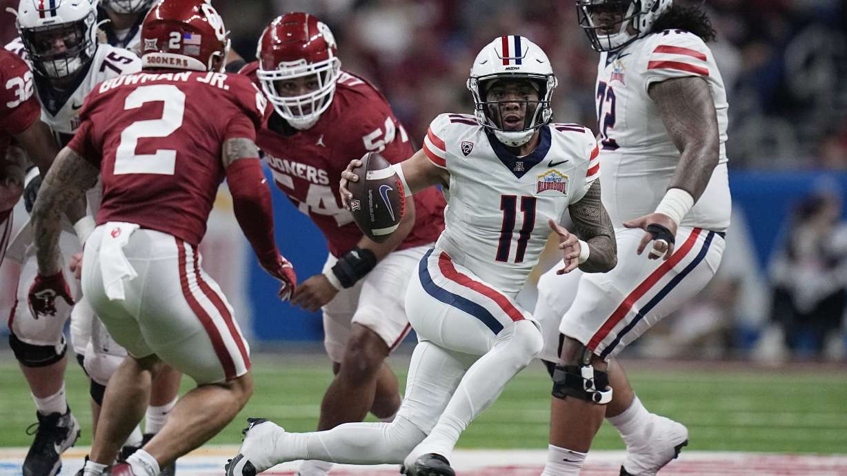 Arizona quarterback Noah Fifita (11) runs against Oklahoma during the first half of the Alamo Bowl NCAA college football game in San Antonio, Thursday, Dec. 28, 2023.