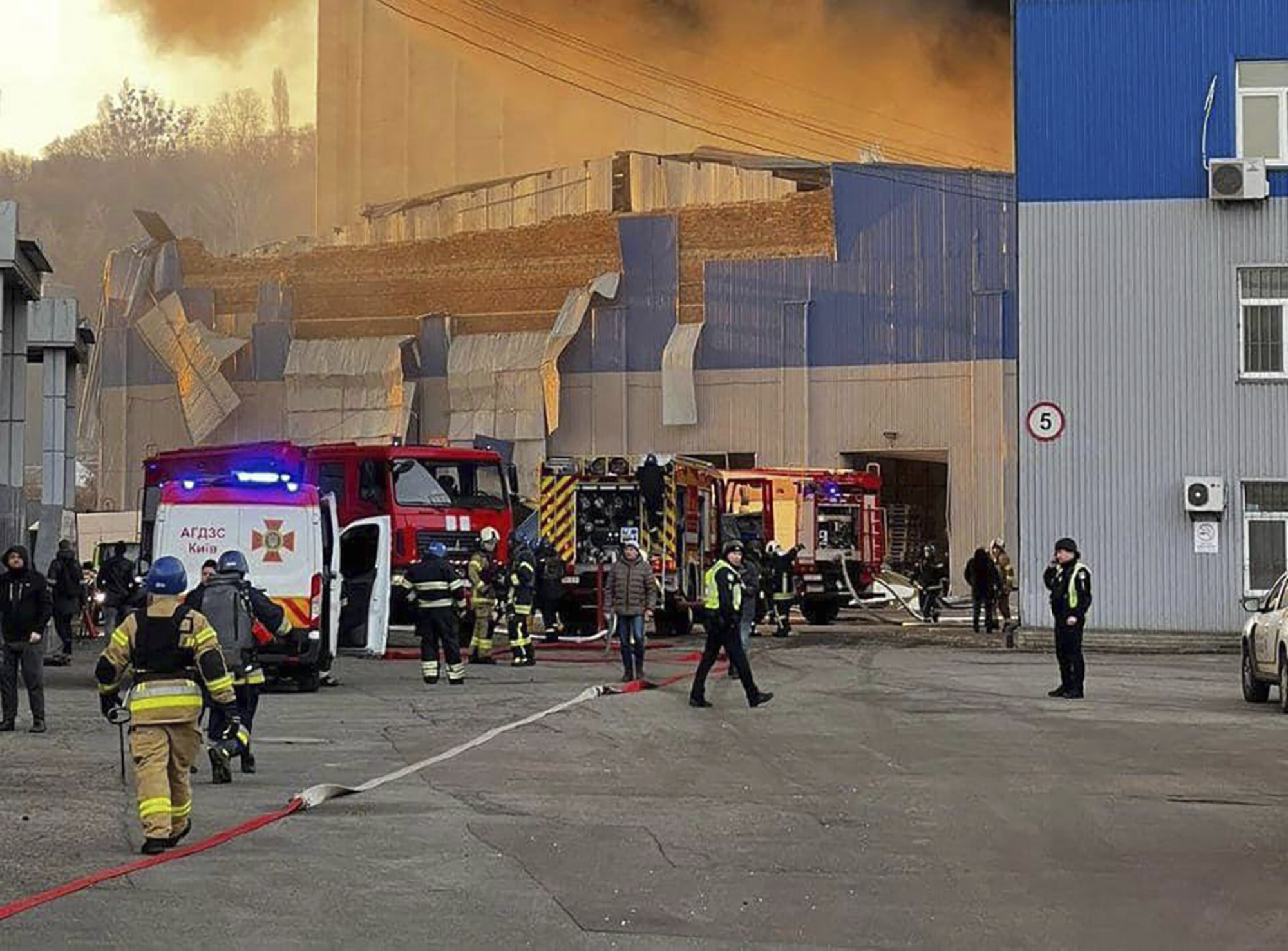 Firefighters work on a site of a building damaged after a Russian attack in Kyiv, Ukraine, Friday.