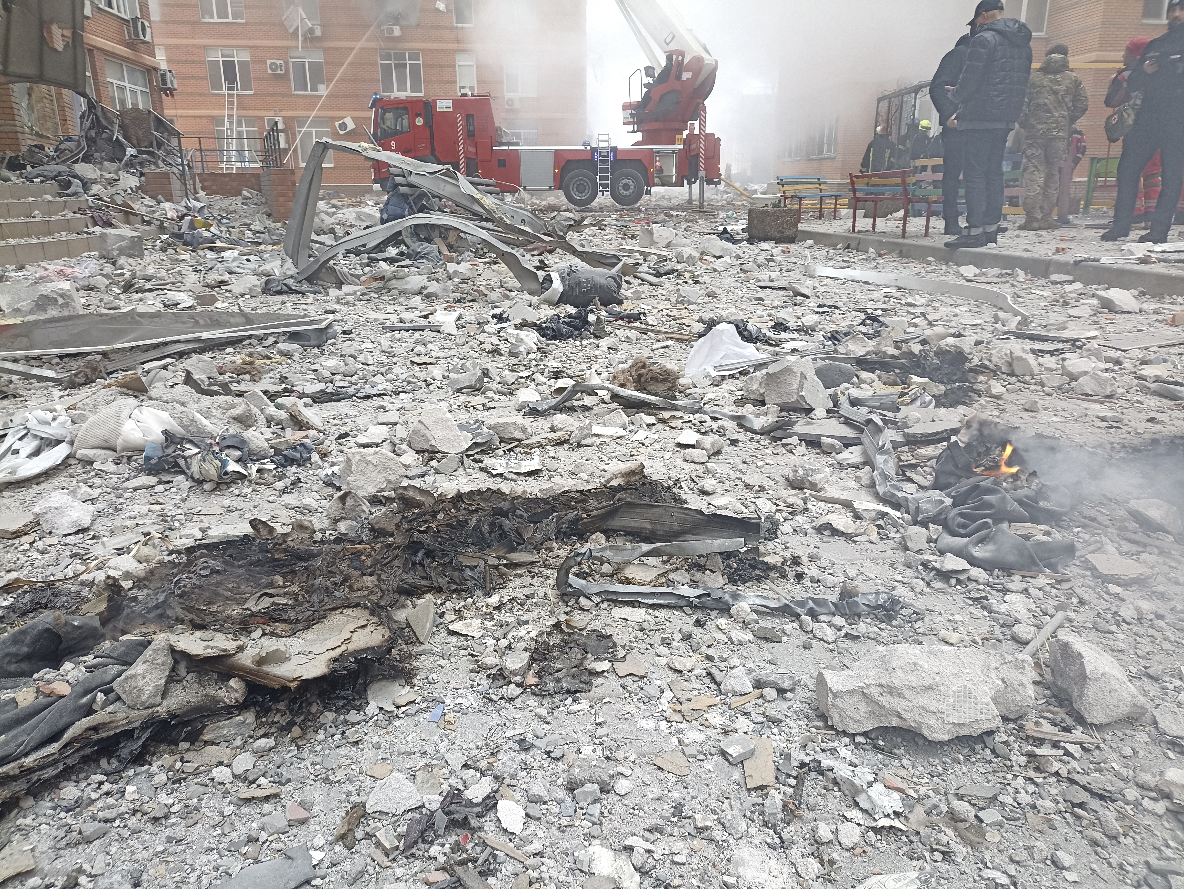 Debris are scattered in a residential area after a Russian attack in Odesa, Ukraine, Friday.