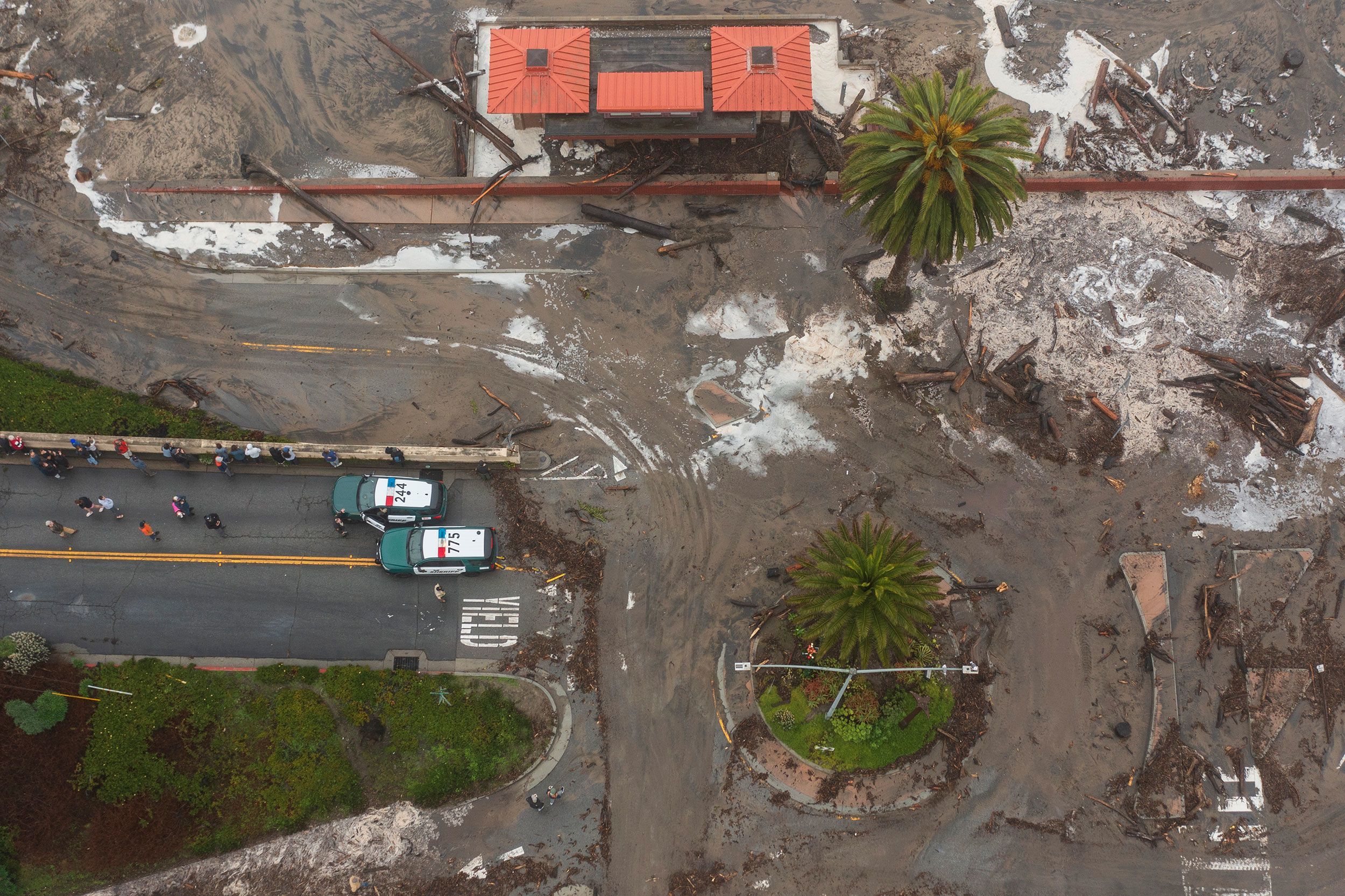 Storm debris fills the Rio Del Mar neighborhood of Aptos in Santa Cruz County. A series of powerful storms in the Pacific Ocean are driving towering waves into the California coastline, triggering flooding and posing a significant risk to people and structures along the coast.