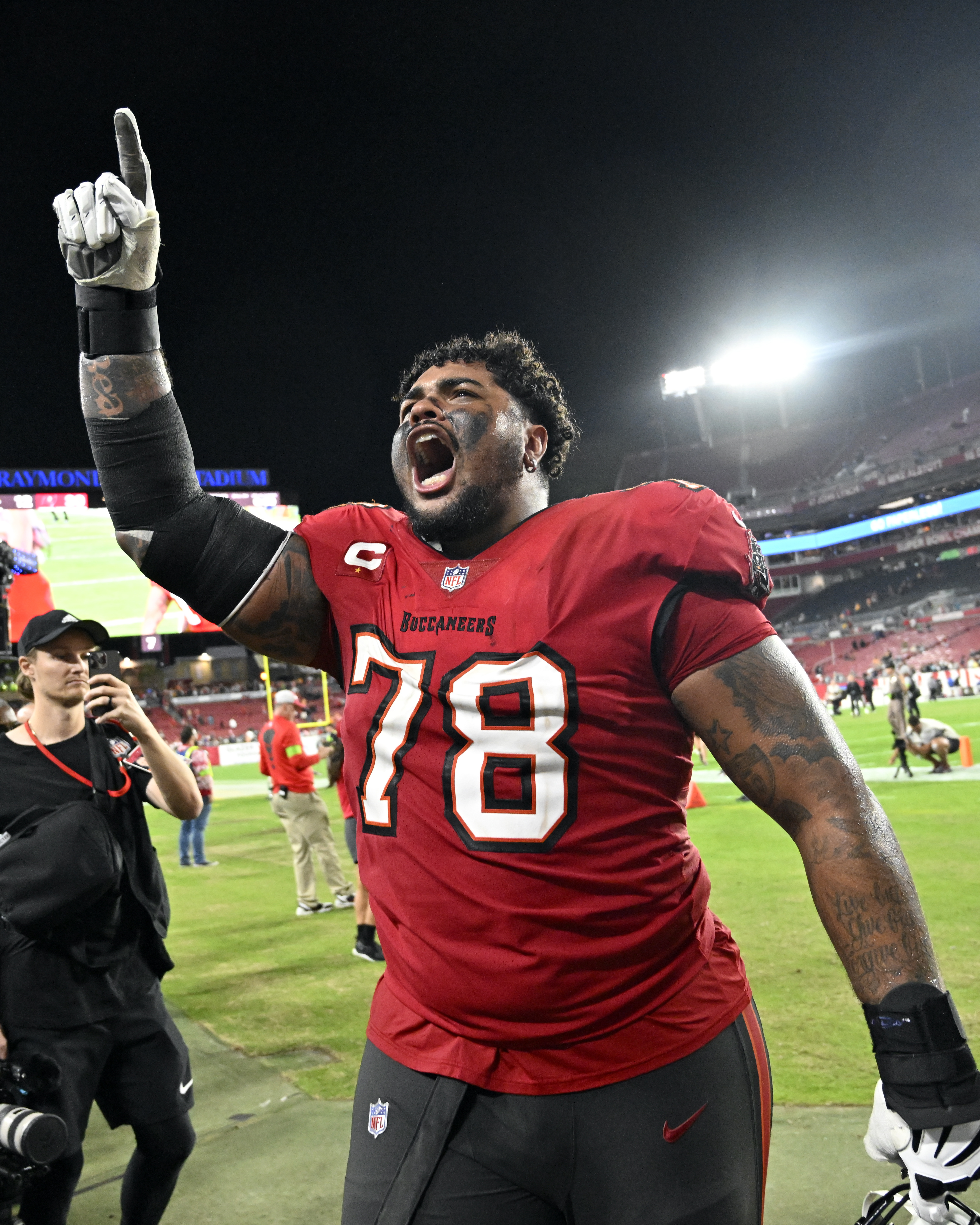 Tampa Bay Buccaneers offensive tackle Tristan Wirfs celebrates with fans as he leave the field after defeating the Jacksonville Jaguars in an NFL football game Sunday, Dec. 24, 2023, in Tampa, Fla.