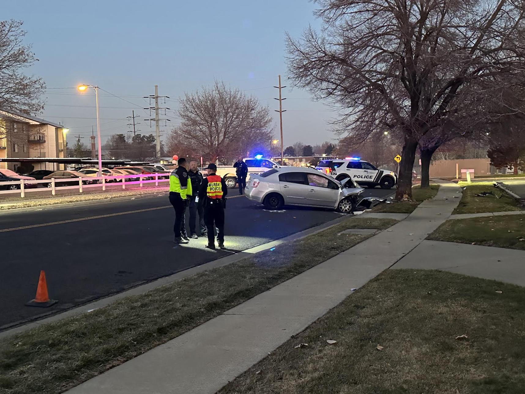 Police are pictured at the scene of a single-vehicle crash that critically injured a man in Taylorsville on Friday.