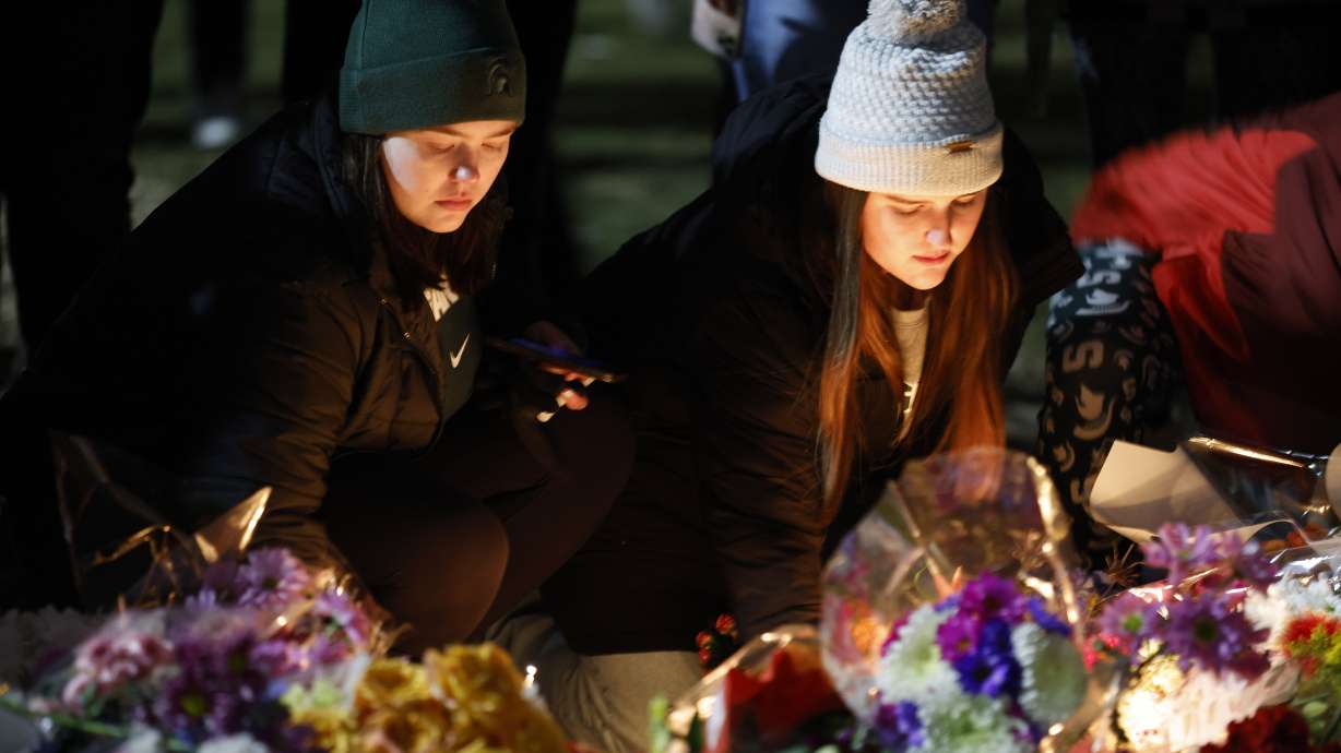 Mourners attend a vigil at The Rock on the grounds of Michigan State University in East Lansing, Mich., Feb. 15. A new report is showing a historic annual decrease in murders across the U.S. in 2023.