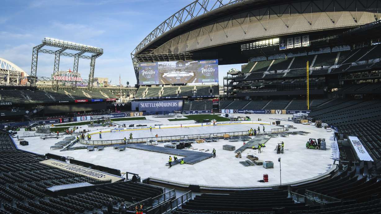 Construction of the rink for the New Year's Day NHL hockey Winter Classic between the Seattle Kraken and the Vegas Golden Knights continues Thursday, Dec. 21, 2023, in Seattle at T-Mobile Park, home of the Seattle Mariners.