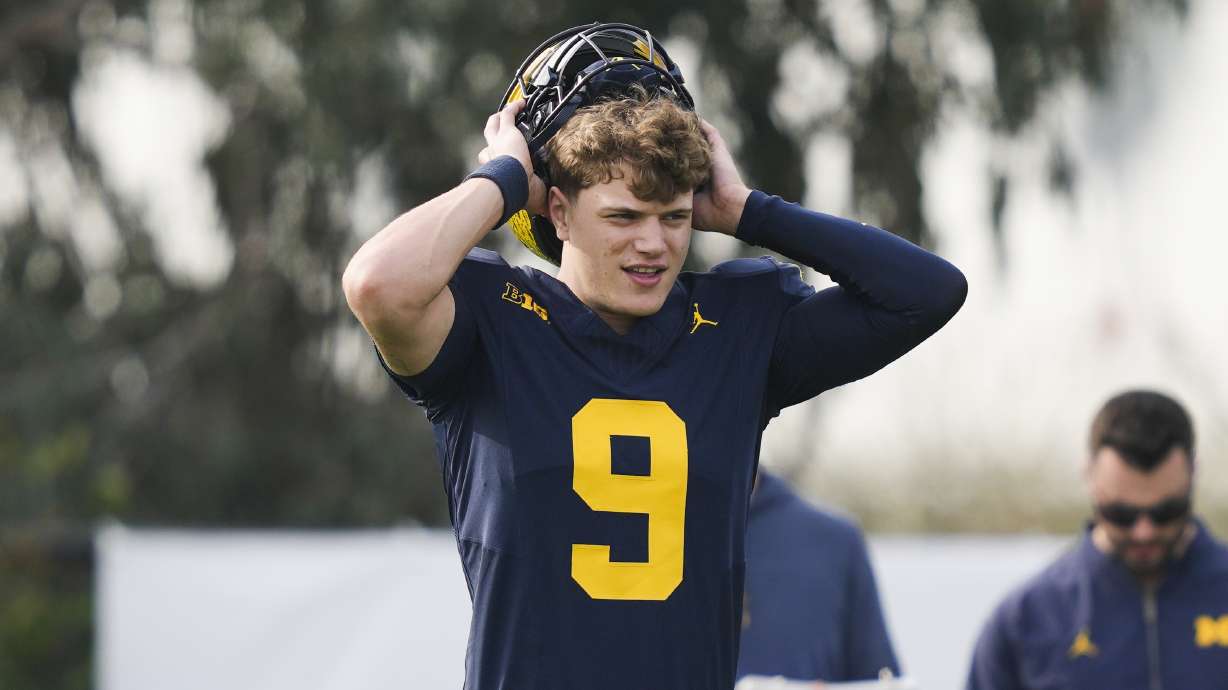 Michigan quarterback J.J. McCarthy warms up during practice Friday, Dec. 29, 2023, in Carson, Calif. Michigan is scheduled to play against Alabama on New Year's Day in the Rose Bowl, a semifinal in the College Football Playoff.