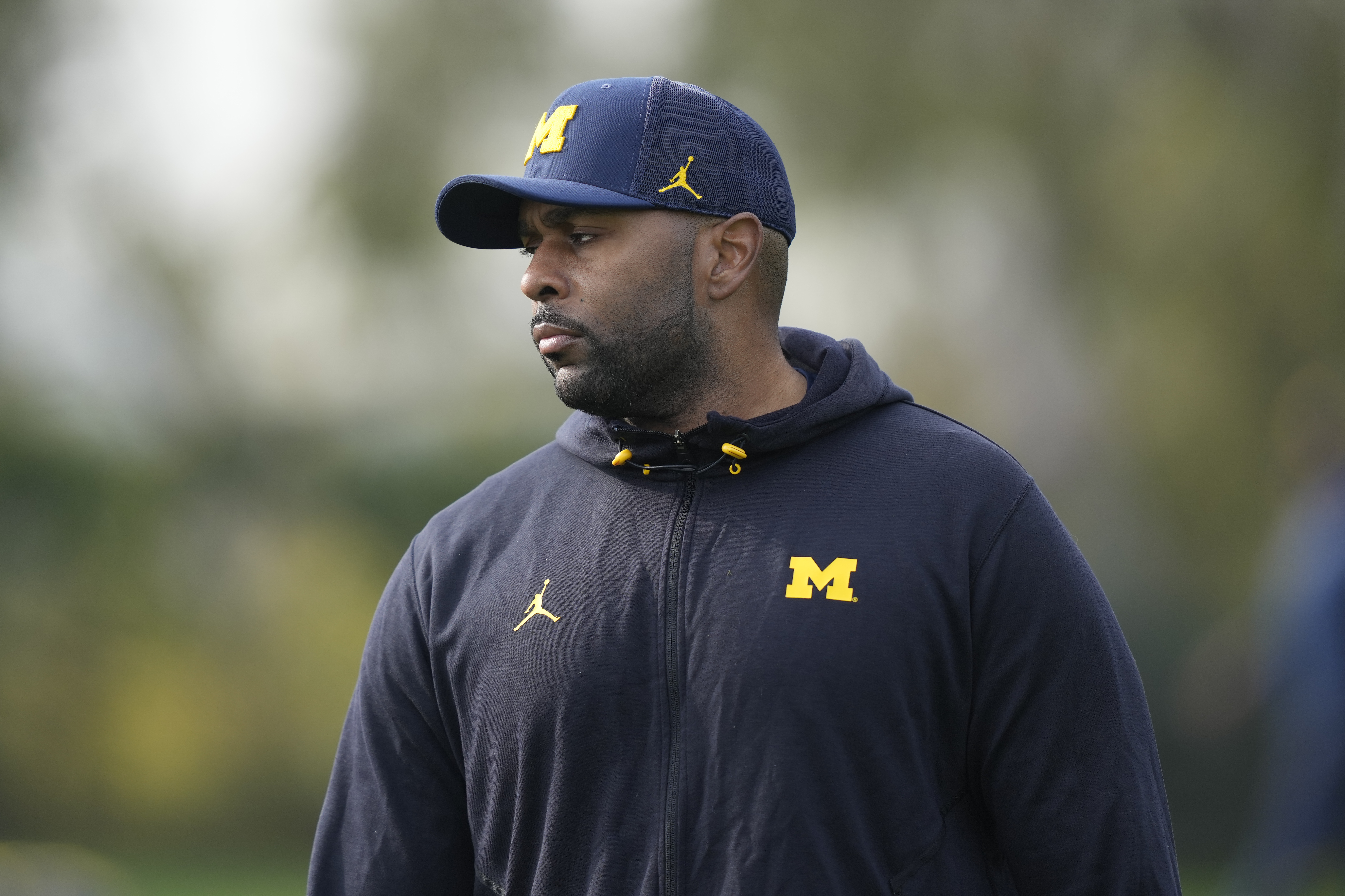 Michigan offensive coordinator Sherrone Moore walks during NCAA college football practice Friday, Dec. 29, 2023, in Carson, Calif. Michigan is scheduled to play against Alabama on New Year's Day in the Rose Bowl, a semifinal in the College Football Playoff.