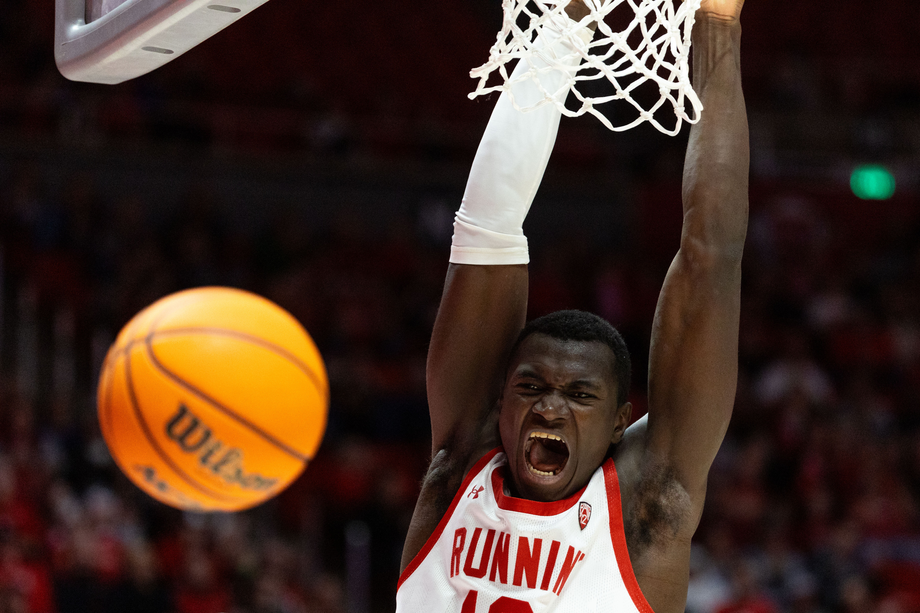 Utah Utes center Keba Keita (13) reacts after dunking the ball during a men’s college basketball game between the University of Utah and Washington State University at the Jon M. Huntsman Center in Salt Lake City on Friday, Dec. 29, 2023.